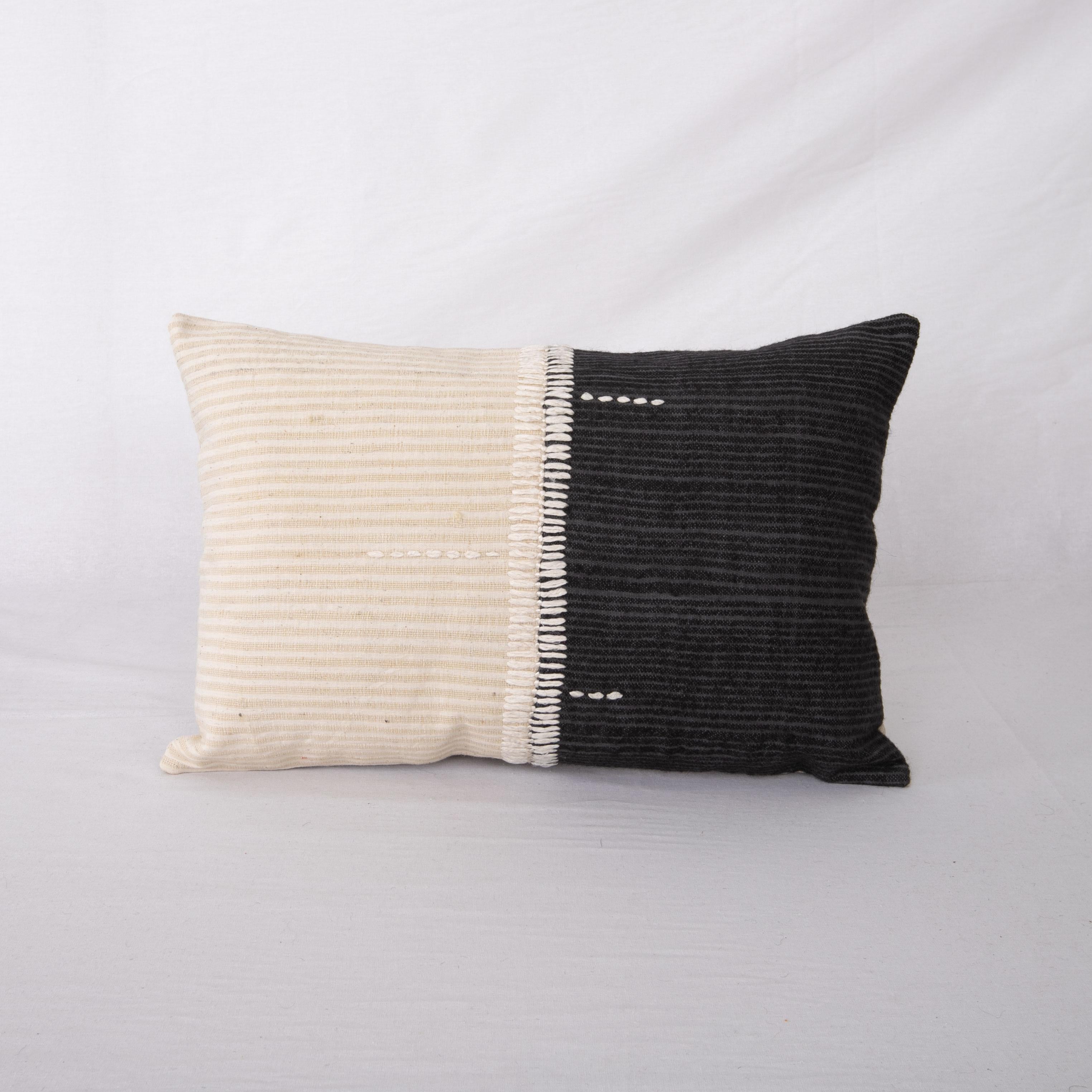 This pillow is made from a vintage hand woven textiles. Our addition to the piece is silk hand stitching. 
It does not come with an insert. 
Linen in the back. 
Zipper closure.
 
 