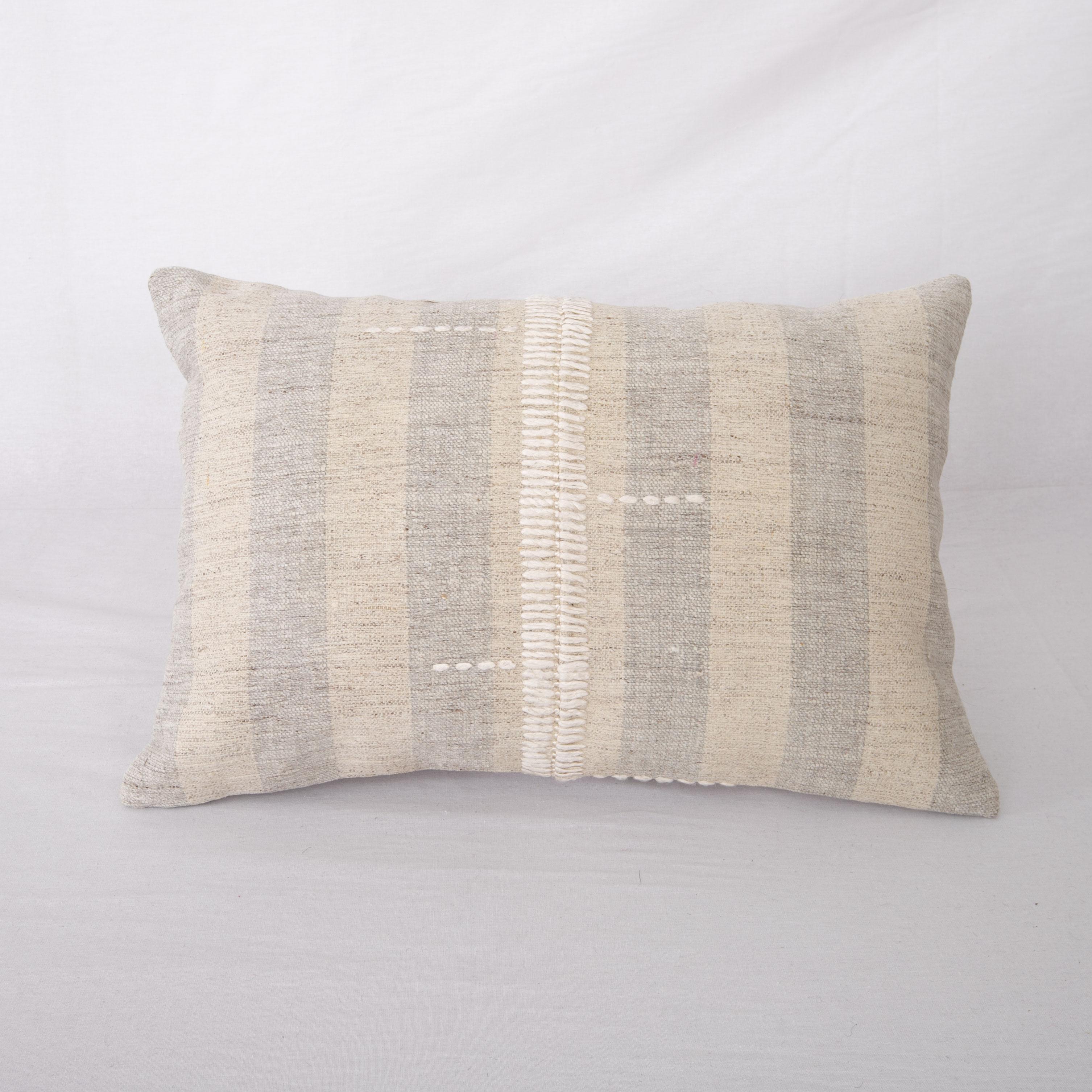 This pillow is made from a vintage hand woven textiles. Our addition to the piece is silk hand stitching. 
It does not come with an insert. 
Linen in the back. 
Zipper closure.
 
 