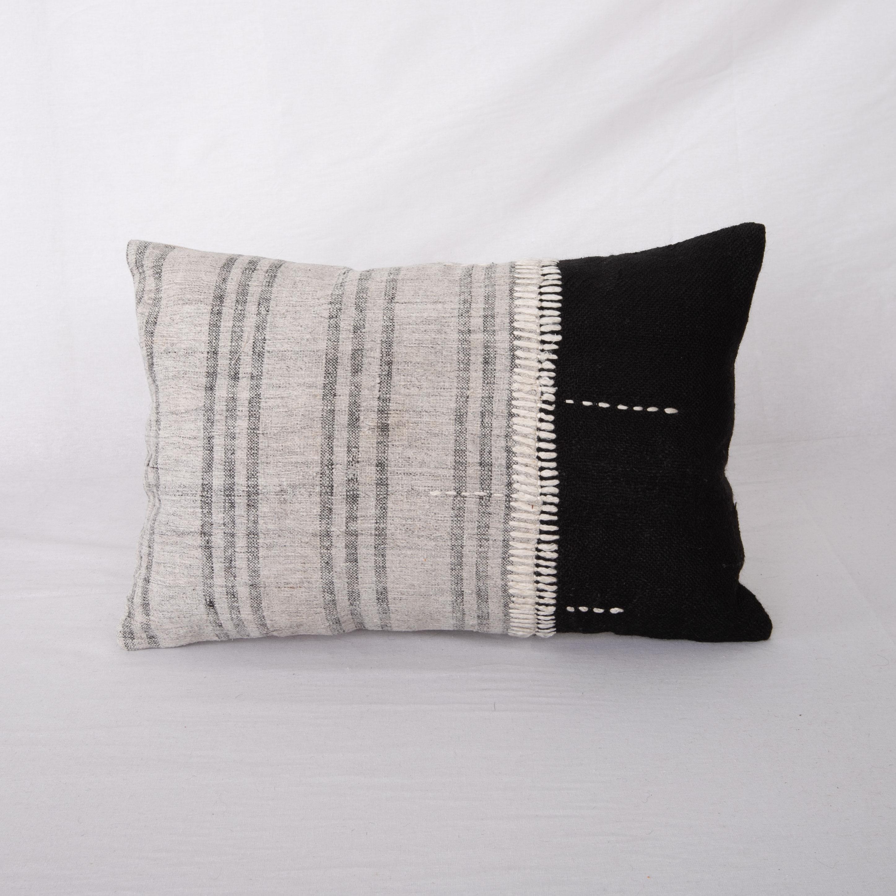 This pillow is made from a vintage hand woven textiles. Our addition to the piece is silk hand stitching. 
It does not come with an insert. 
Linen in the back. 
Zipper closure.

 