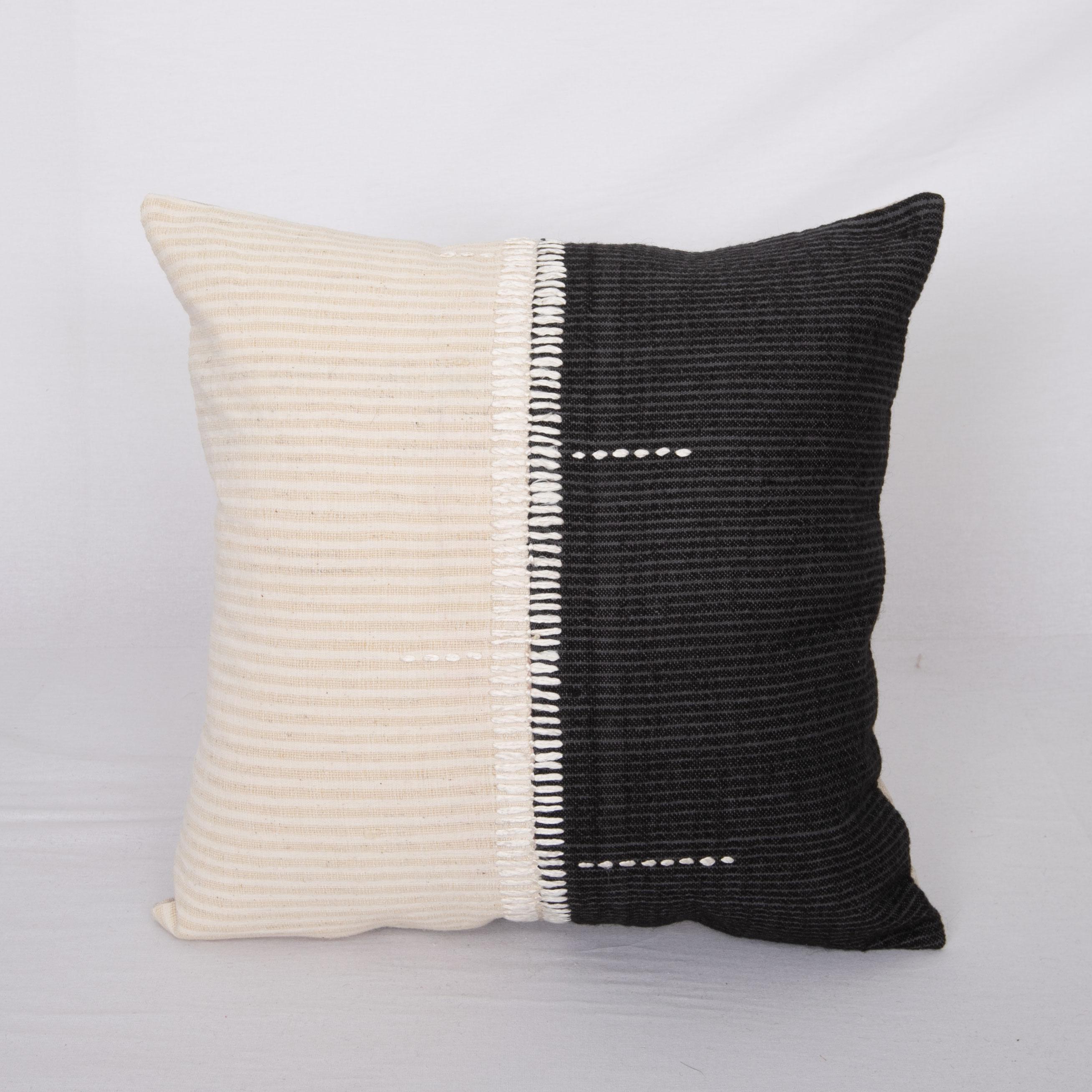 This pillow was made from vintage hand woven textiles. Our addition to the piece is silk hand stitching as a detail. 
It does not come with an insert. 
Linen in the back. 
Zipper closure.
 