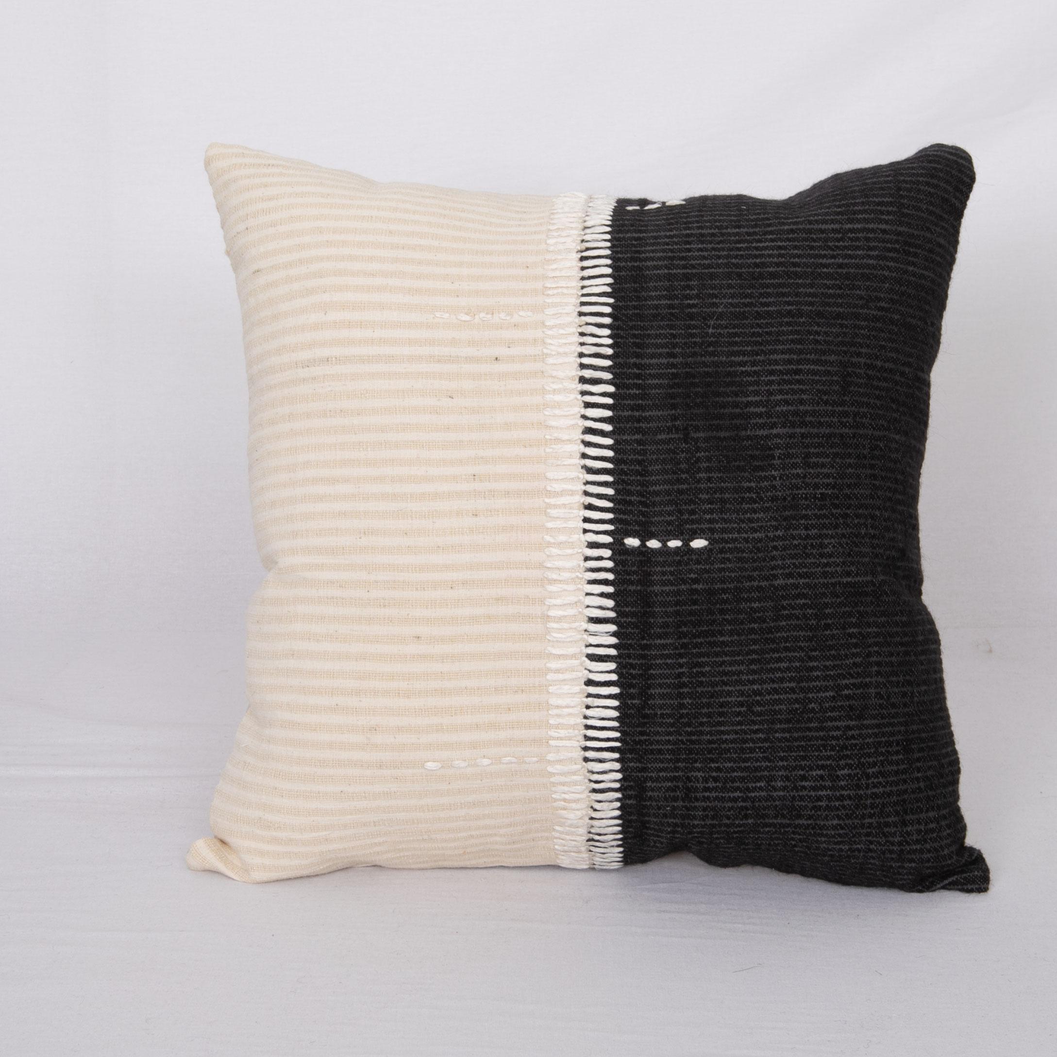 This pillow was made from vintage hand woven textiles. Our addition to the piece is silk hand stitching as a detail. 
It does not come with an insert. 
Linen in the back. 
Zipper closure.
 
 