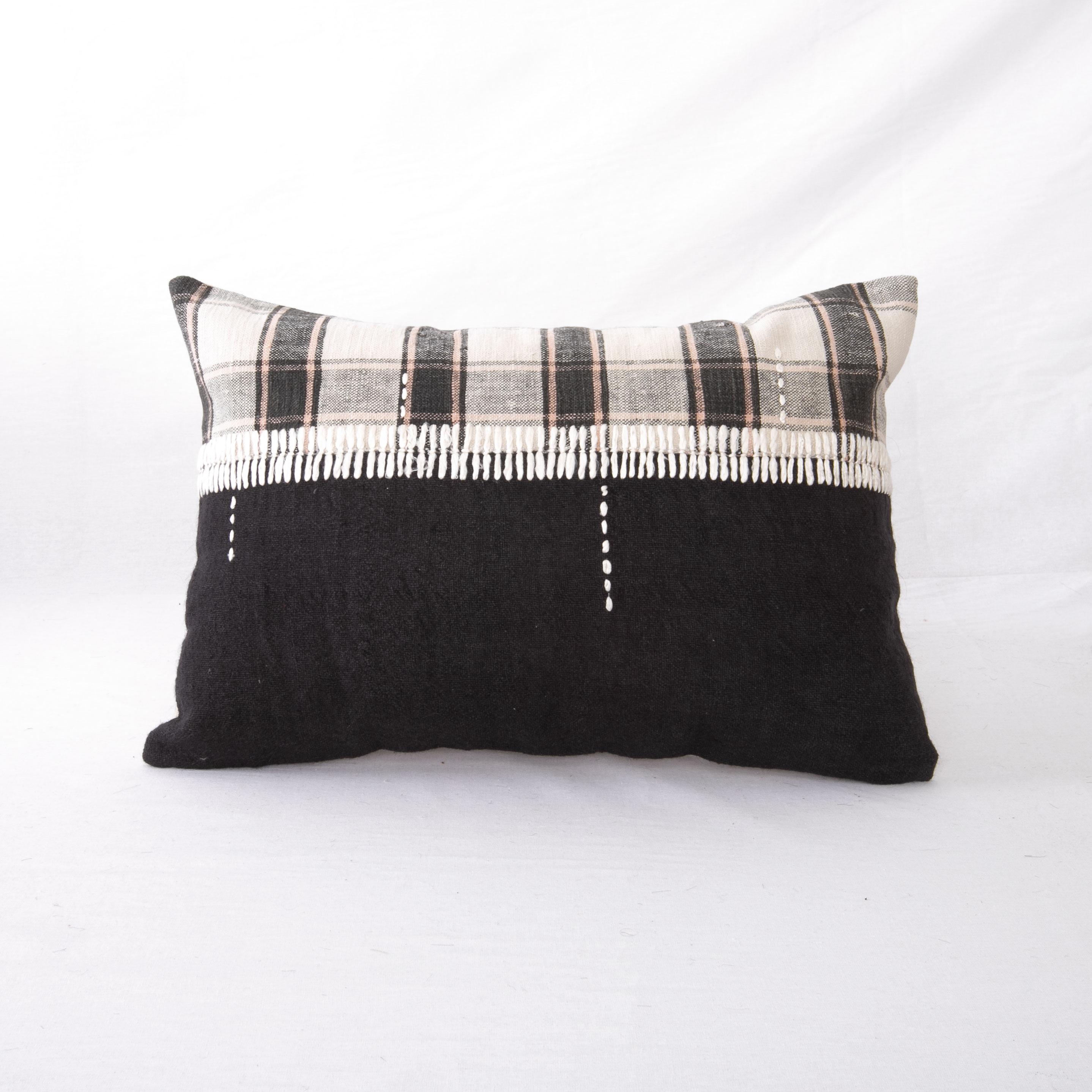 This pillow was made from  vintage hand woven textiles. Our addition to the piece is silk hand stitching as a detail. 
It does not come with an insert. 
Linen in the back. 
Zipper closure.
   
