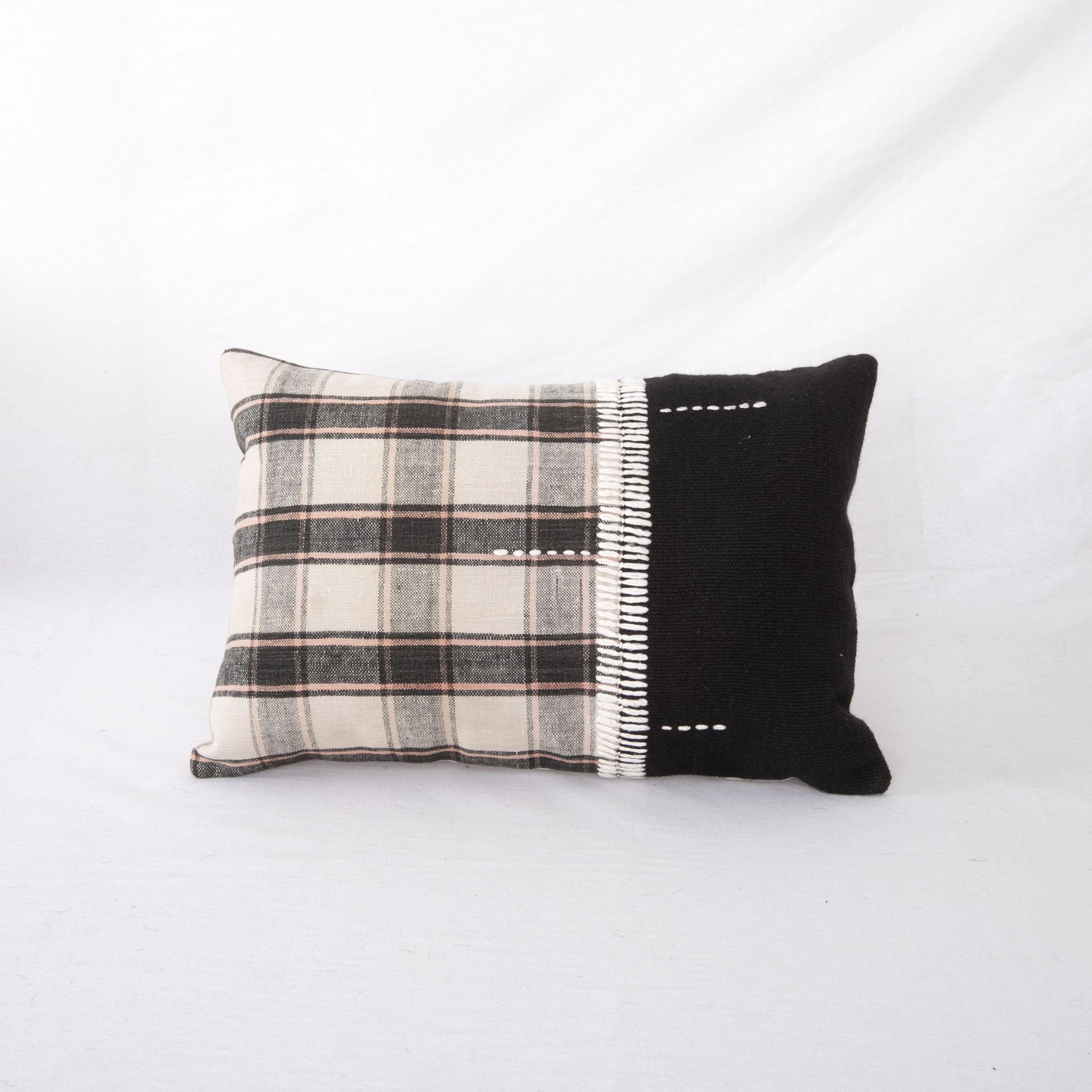 This pillow was made from  vintage hand woven textiles. Our addition to the piece is silk hand stitching as a detail. 
It does not come with an insert. 
Linen in the back. 
Zipper closure.
   
