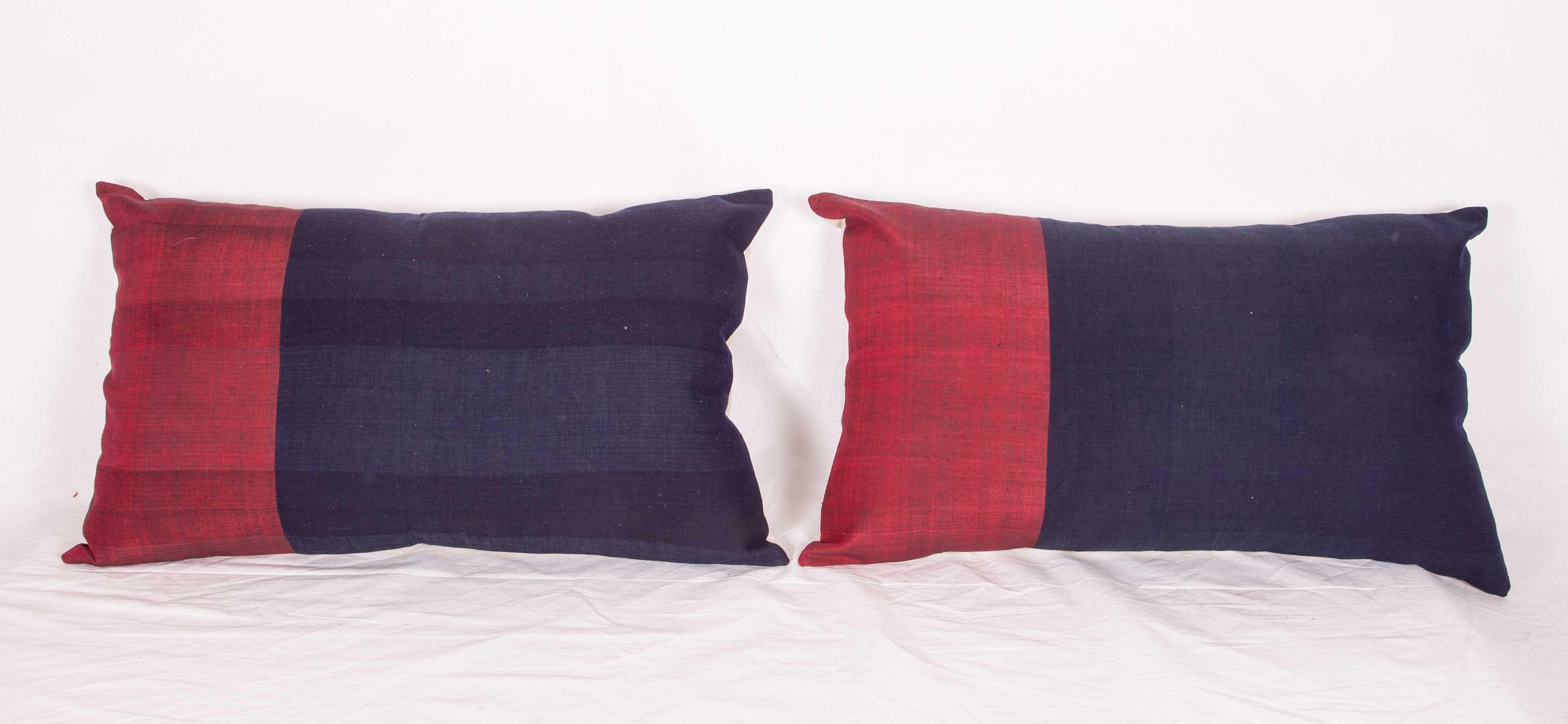 The pillow cases were made from an early 20th century Afghan Waziri, silk and cotton shawl. The red parts are in silk. They do not come with inserts but it come with bags made to the size and out of cotton to accommodate the filling materials. The