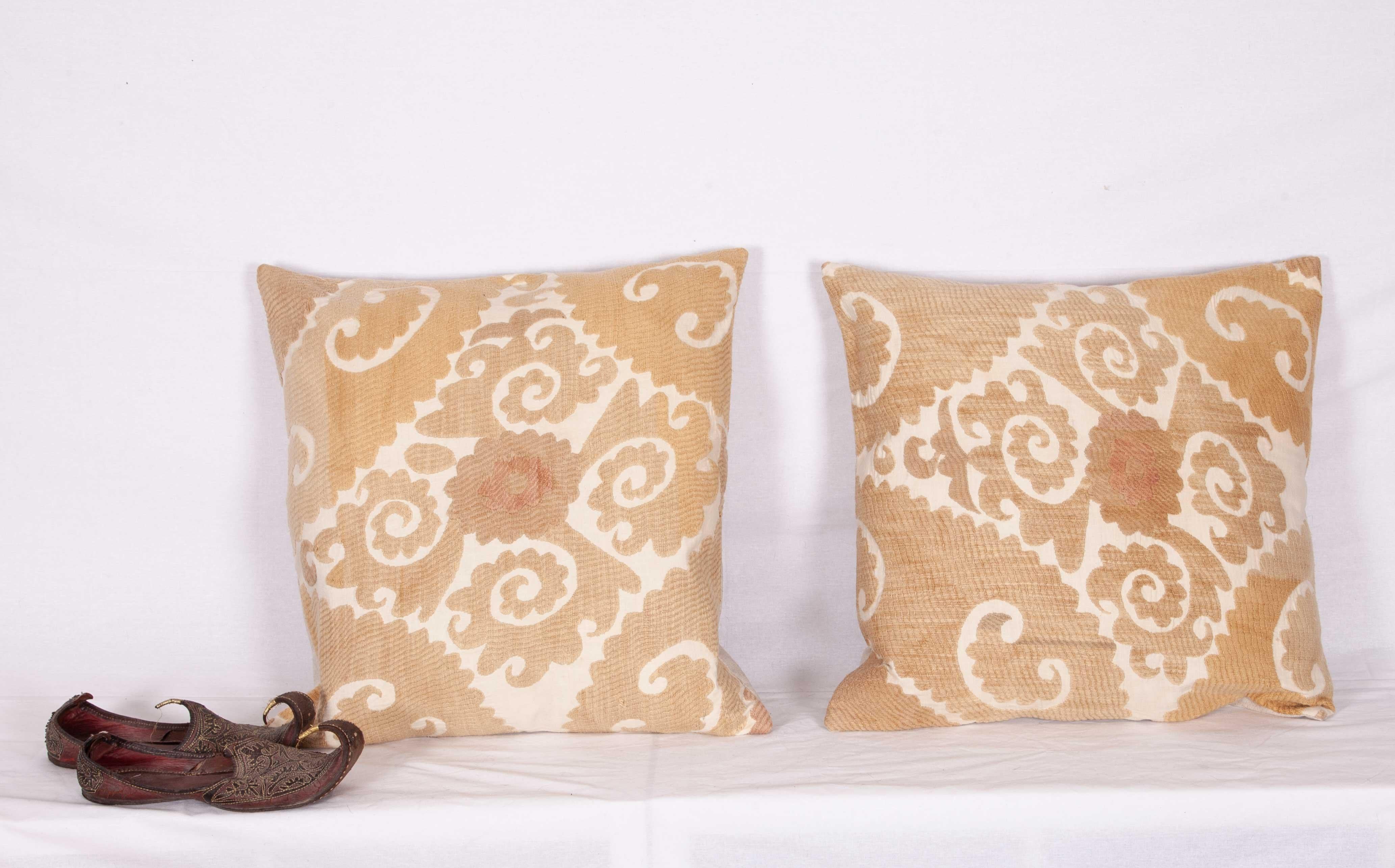 The pillow cases were made out of an mid-20th century, Uzbek Samarkand Suzani. They not come with inserts but come with bags made to the size and out of cotton to accommodate the filling materials. The backing is made of linen. Please note filling
