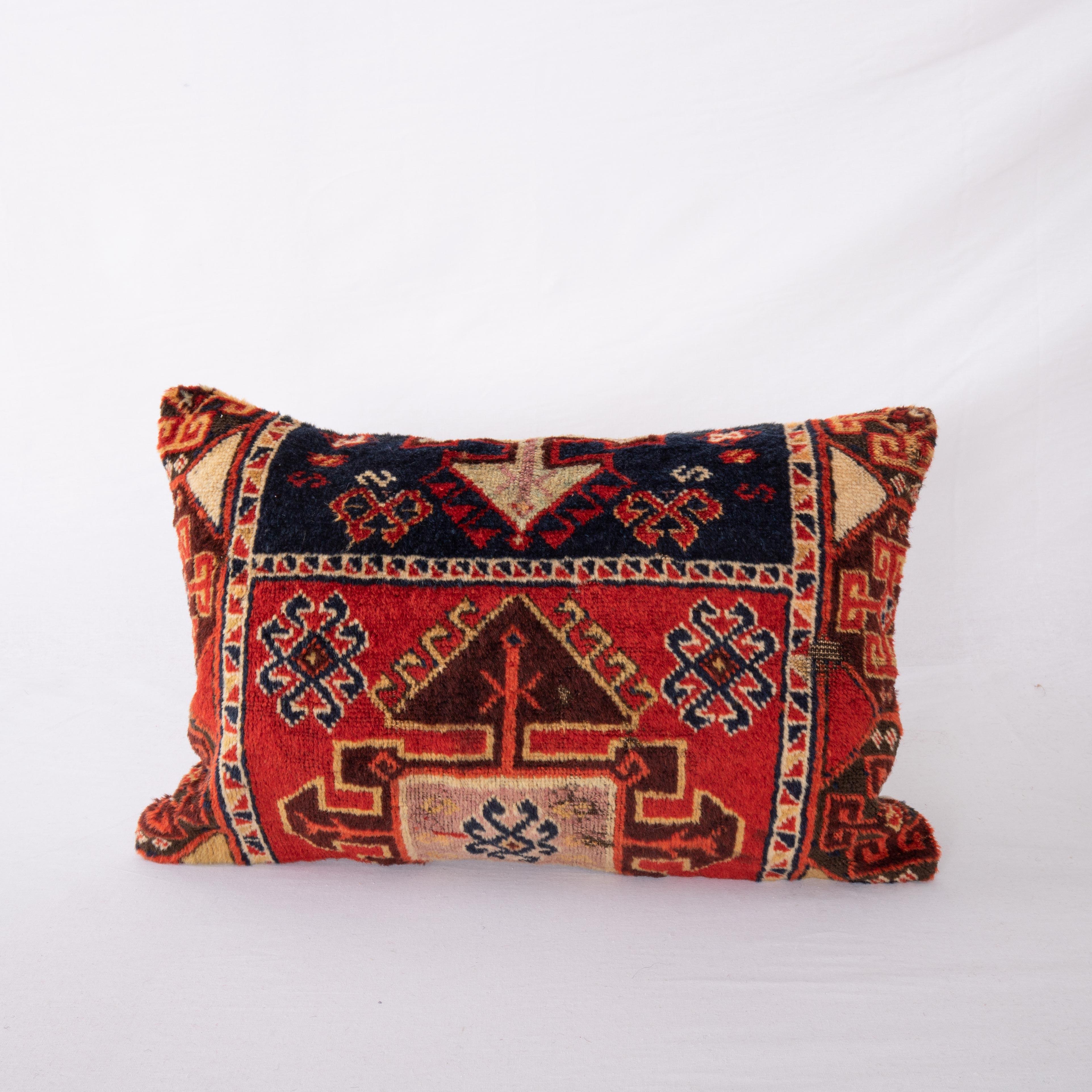 Eastern Anatolian rugs are famous for their wool and color quality. This pillow cover is made from a fragment of a such a great rug.

It does not come with an Insert.
Cotton in the back.
Zipper closure.
Dry clean is recommended.
 