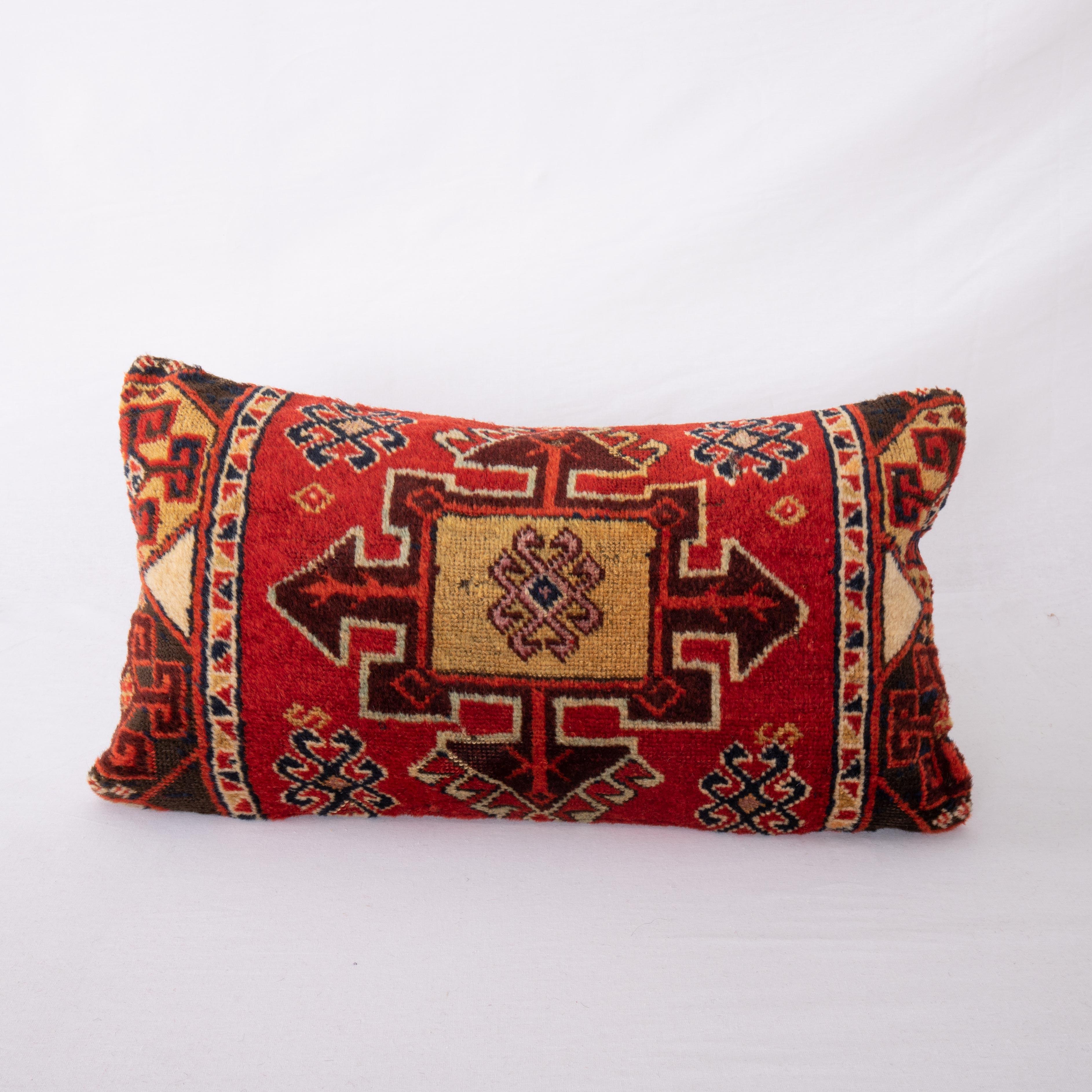 Eastern Anatolian rugs are famous for their wool and color quality. This pillow cover is made from a fragment of a such a great rug.

It does not come with an Insert.
Cotton in the back.
Zipper closure.
Dry clean is recommended.
  