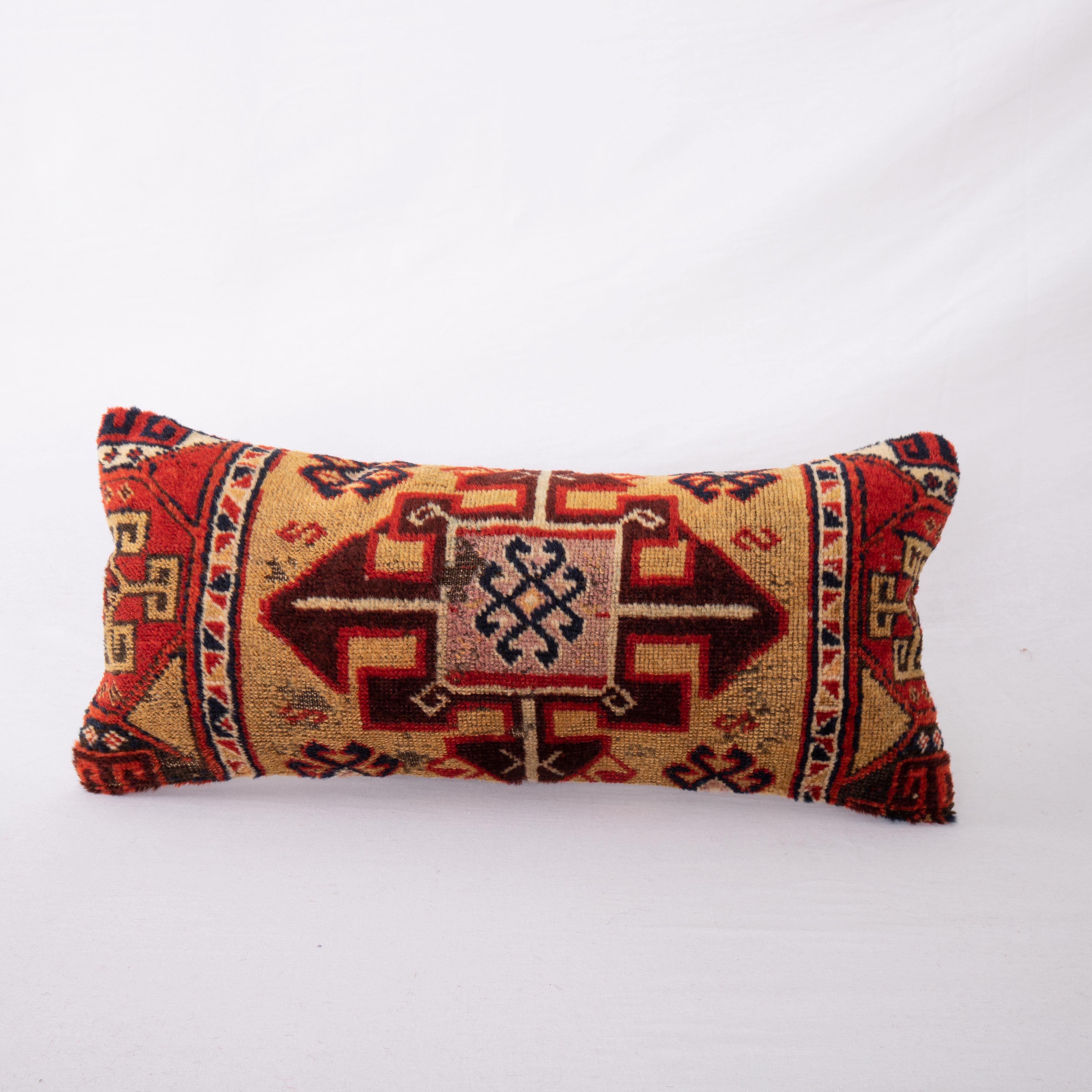Eastern Anatolian rugs are famous for their wool and color quality. This pillow cover is made from a fragment of a such a great rug.

It does not come with an Insert.
Cotton in the back.
Zipper closure.
Dry clean is recommended.

