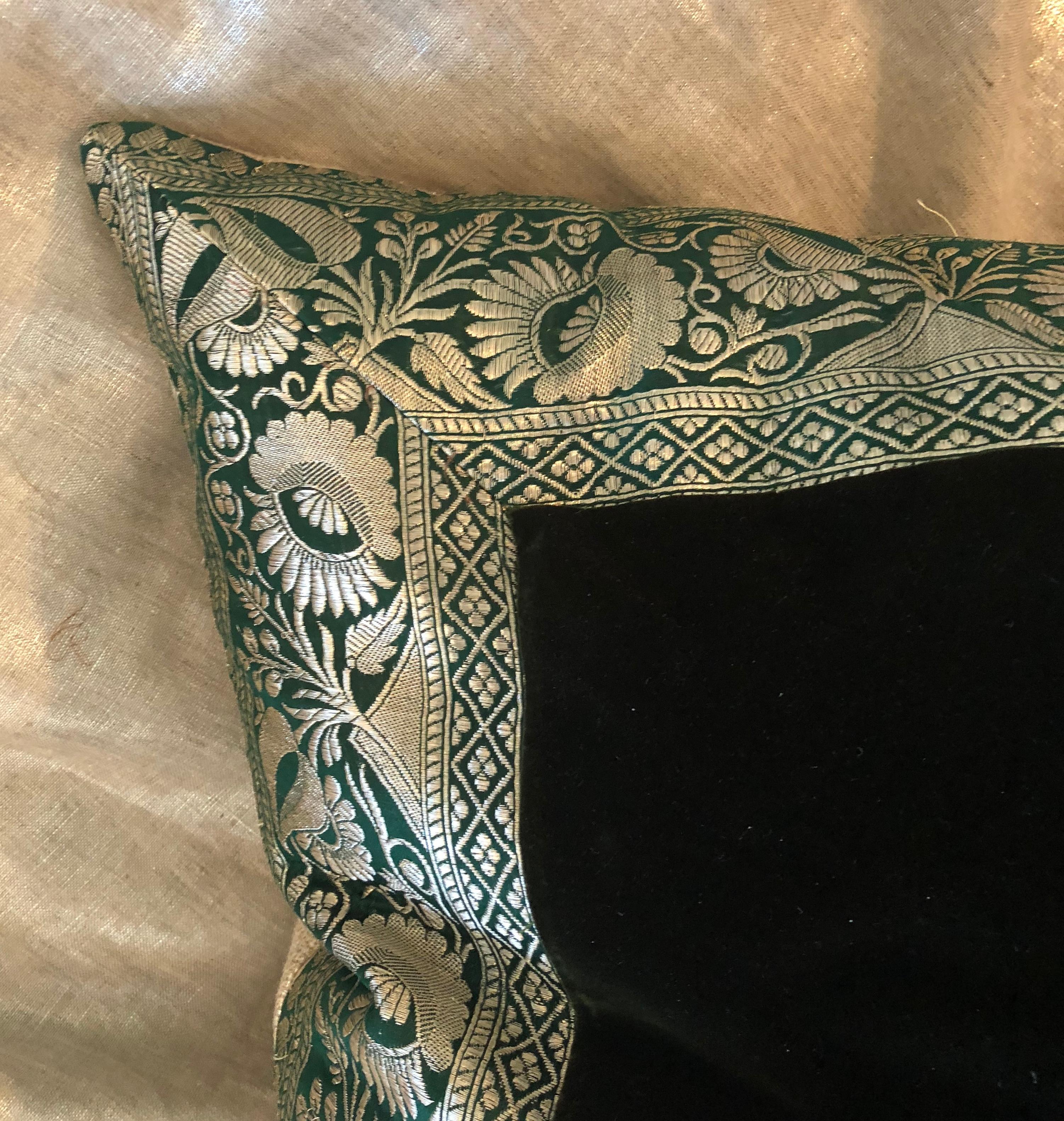 This refined pillow is created from 19th century silk velvet and bordered with an antique Indian metallic trim. The large square pillow is sophisticated and opulent. The velvet is of the deepest bottle green accented by the silver metallic threads