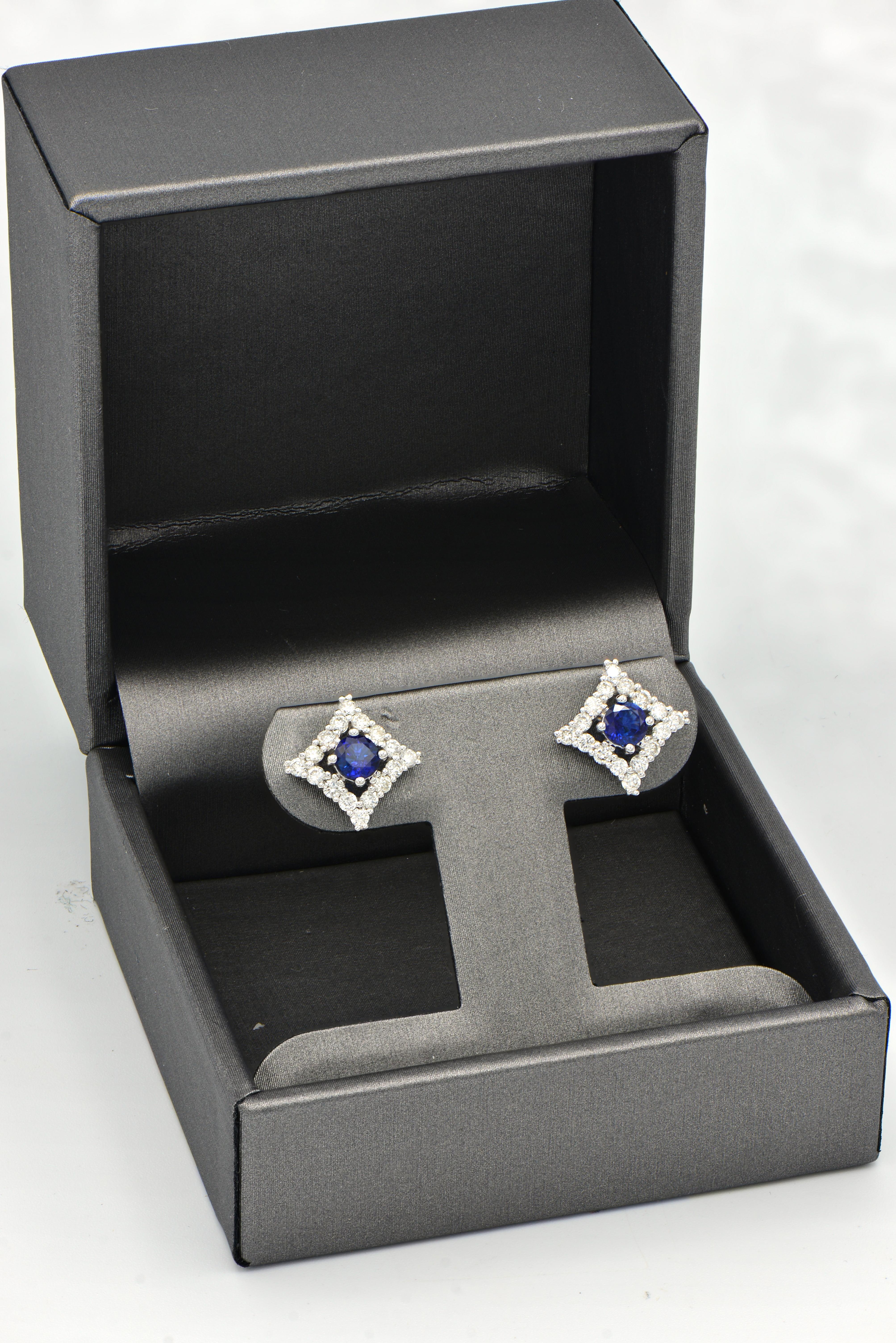 These unique Sapphire and Diamond earrings are sure to turn heads with their original shape while still maintaining comfort and ease with a standard stud back. These earrings contain royal blue sapphires totaling 0.67 carats which are surrounded by