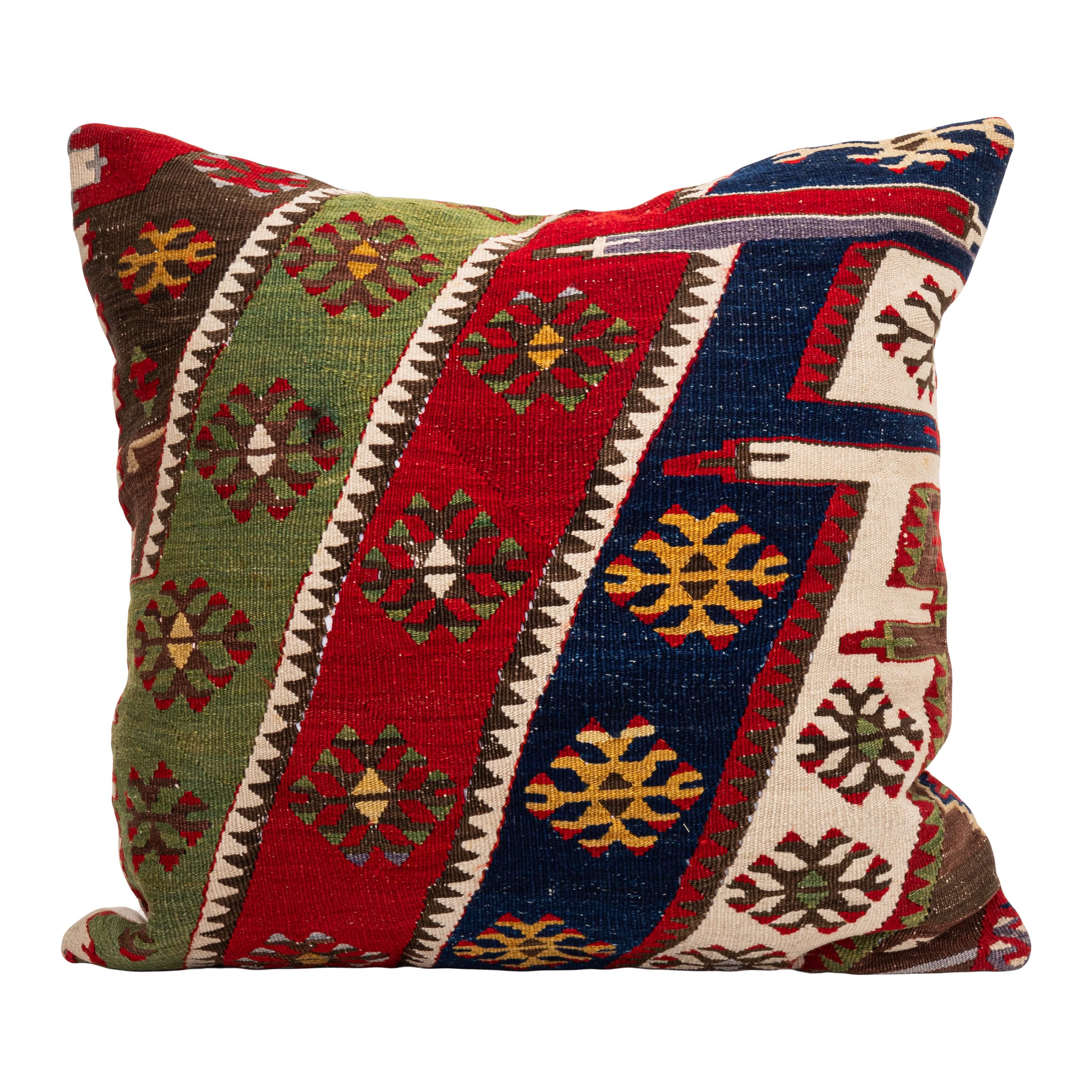 It is made from an early 20th C.Anatolian kilim. 
Linen in the back.
Zipper closure.
Dry cleaning is recommended.
