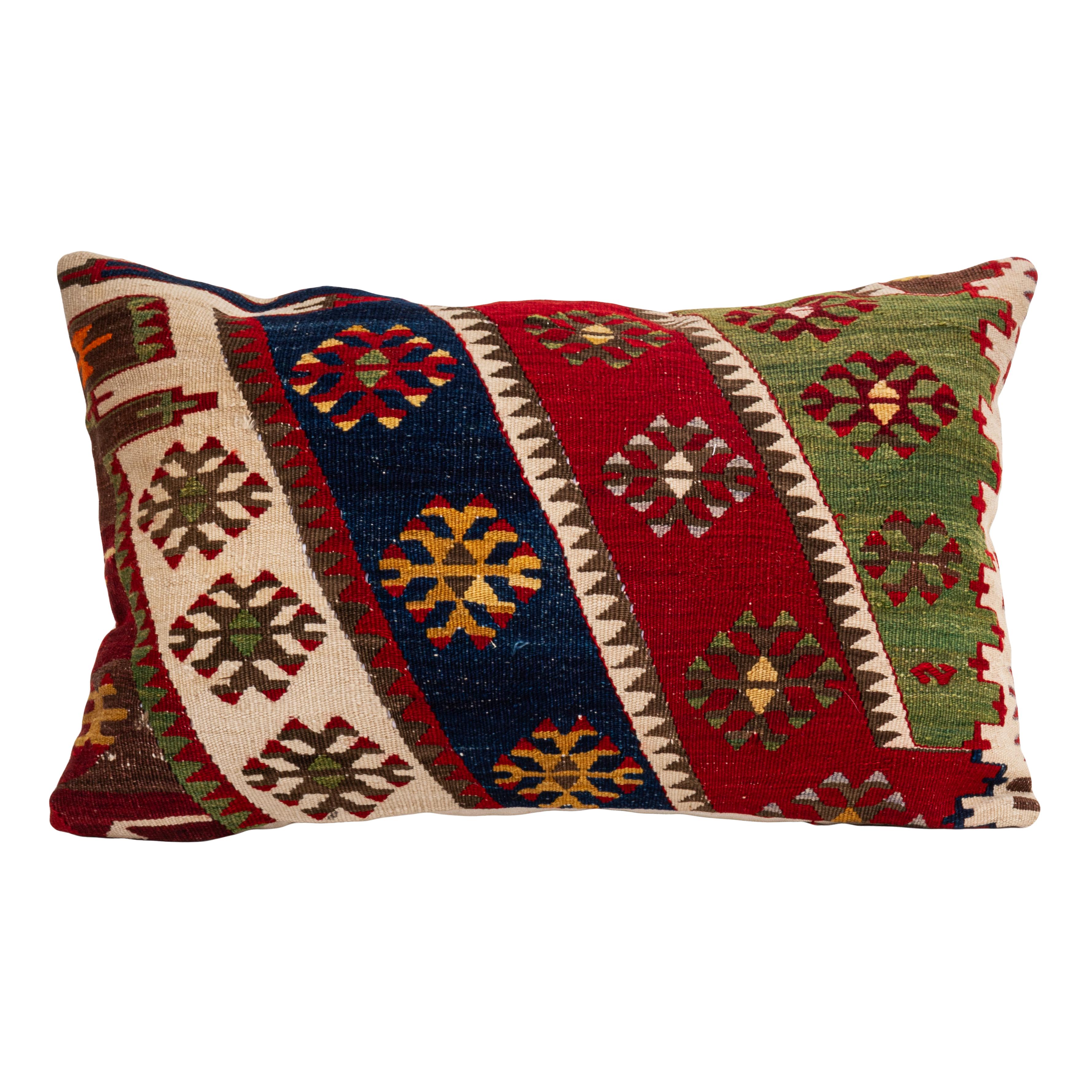 It is made from an early 20th C.Anatolian kilim. 
Linen in the back.
Zipper closure.
Dry cleaning is recommended.
