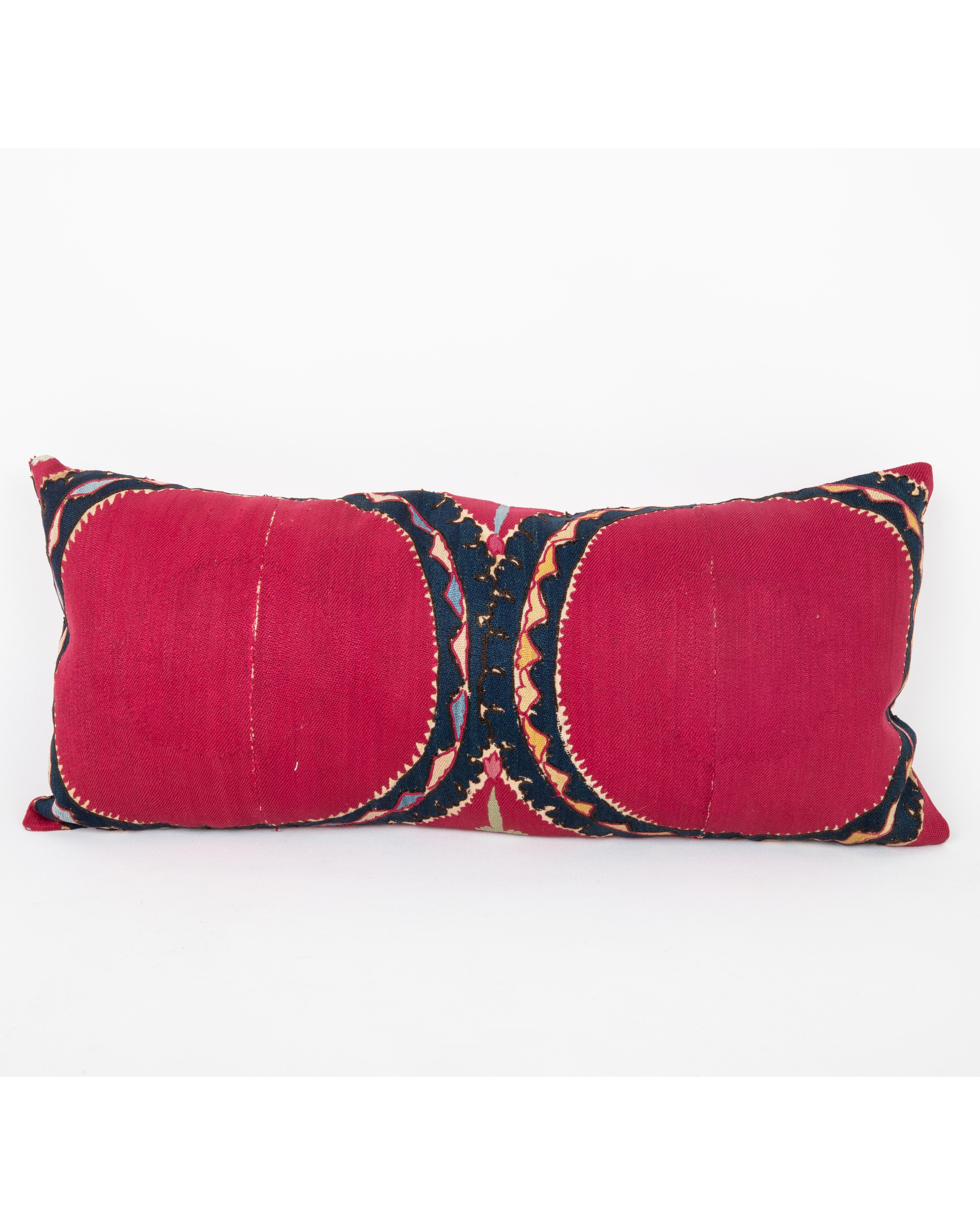 It does not come with an insert.
Linen in the back.
Zipper Closure.
Dry Cleaning recommended.

This  pillow has been fashioned from an antique Tashkent suzani, distinguished by its deep red ground and the classic “Ai Palak” (Moon Sky) motif — a