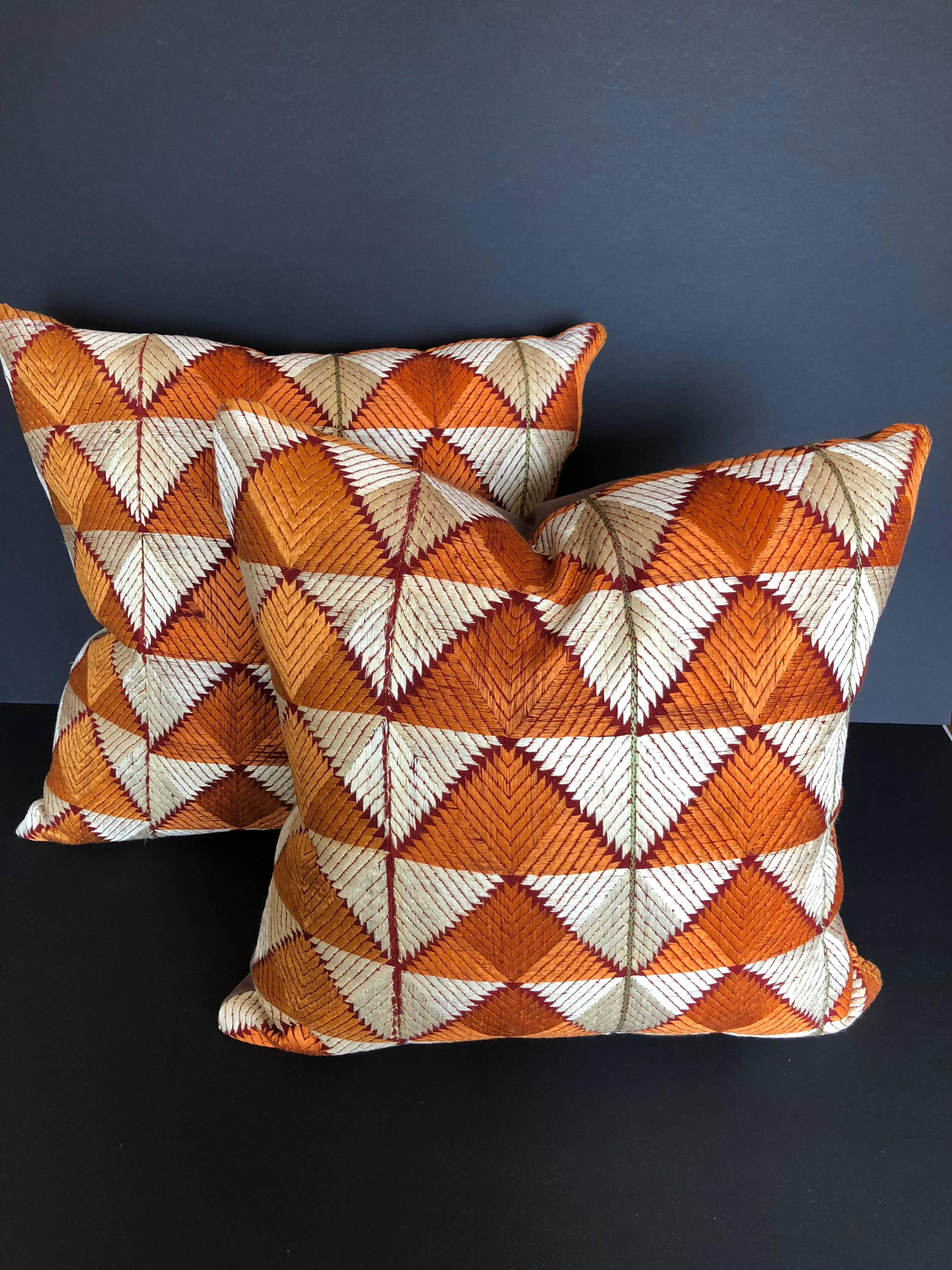 Pillows cut from a vintage silk Phulkari Bagh wedding shawl from Punjab, India. Hand-loomed cotton khadi cloth is hand embroidered with vibrant silk threads. The shawl is made by relatives of the young bride for her wedding and other important