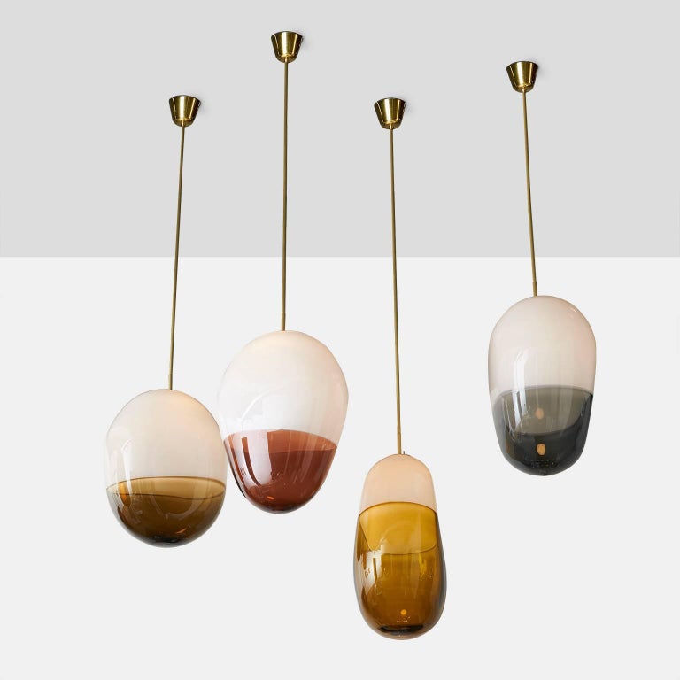 A free handblown pendant with a LED bulb on a custom brass rod by noted Parisian glass blower Jeremy Maxwell Wintrebert. The large scaled pendants vary in shape and size. Colors vary. We have 4 remaining - shallow yellow, blue, red and deep yellow.