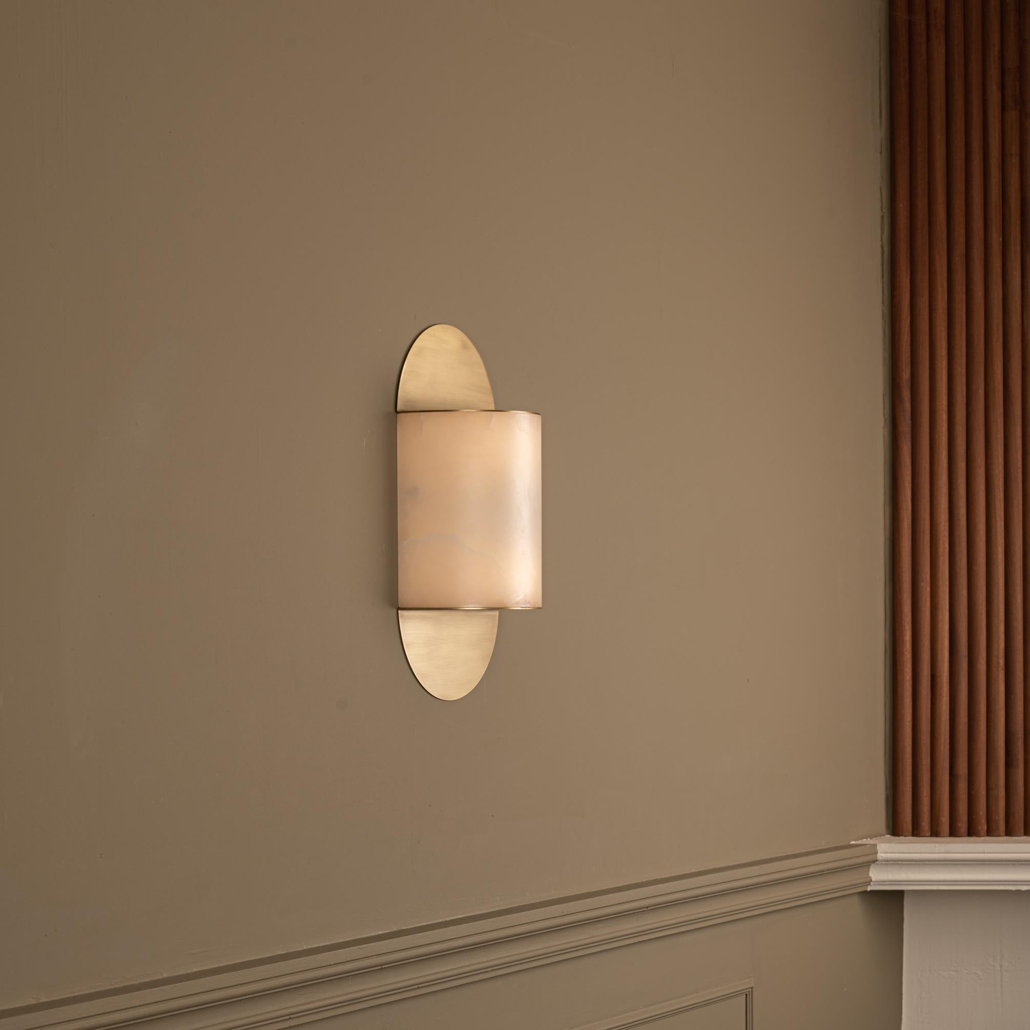 Pilolo Brass Wall Sconce by Simone & Marcel
Dimensions: D 11 x W 22 x H 42 cm.
Materials: Brass and alabaster.

Available in different brass and alabaster options and finishes. Custom options available on request. Please contact us. 

All our lamps