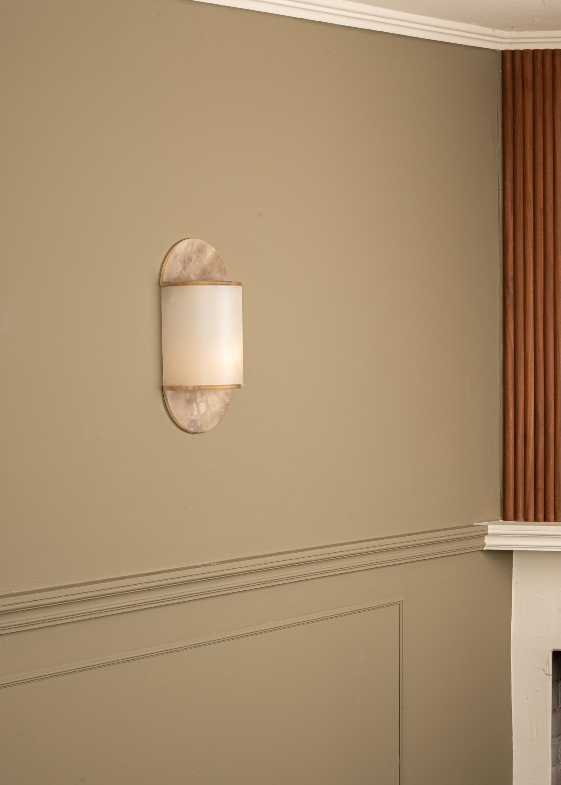 Pilolo Tobacco Alabaster Wall Sconce by Simone & Marcel
Dimensions: D 11 x W 22 x H 42 cm.
Materials: Alabaster.

Available in different brass and alabaster options and finishes. Custom options available on request. Please contact us. 

All our