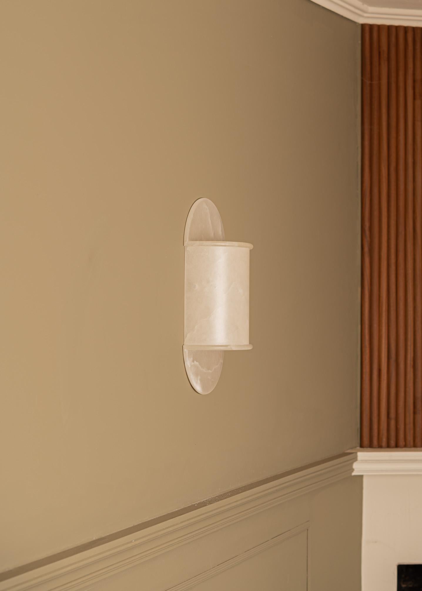 Pilolo White Alabaster Wall Sconce by Simone & Marcel
Dimensions: D 11 x W 22 x H 42 cm.
Materials: White alabaster.

Available in different brass and alabaster options and finishes. Custom options available on request. Please contact us. 

All our