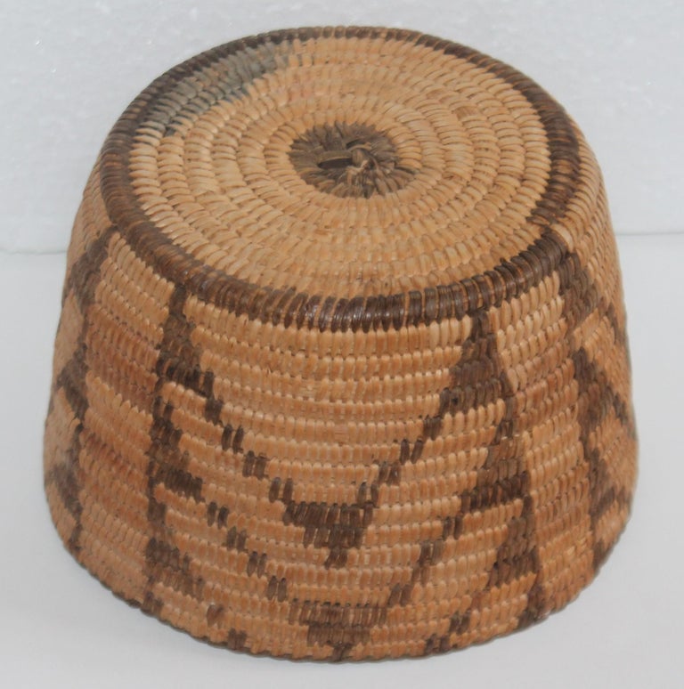 This fine tightly woven Pima American Indian basket in unusual geometric pattern is in fine condition. The scale is so wonderful with a nice aged patina.