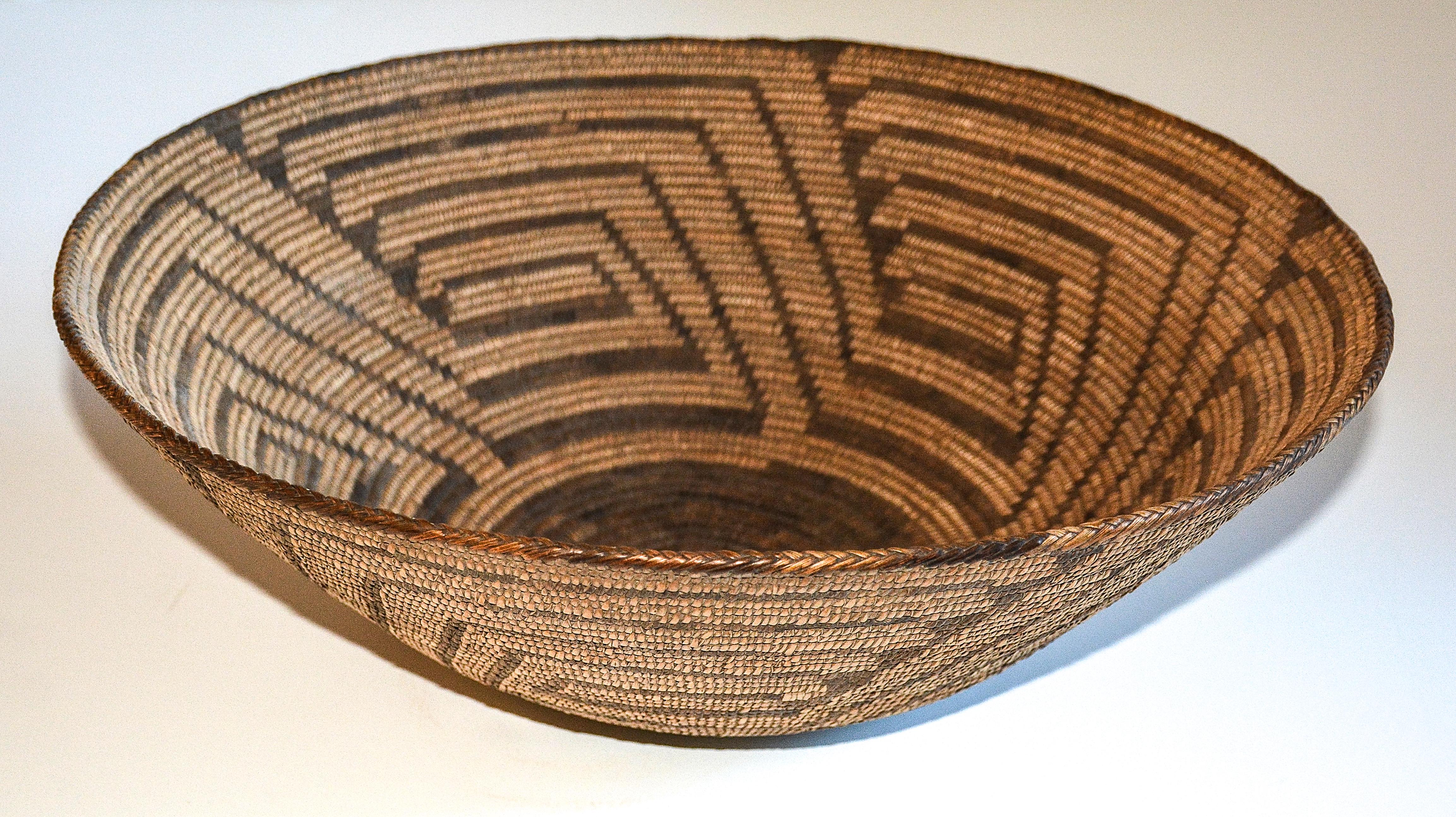 Pima basket
1890
Willow and Devil's Claw
Measures: 6.25 inches Height. x 17 inches in Diameter

This large example of a coiled Pima basket dates from 1890.

 The basket appears in excellent original condition with no restoration and an even