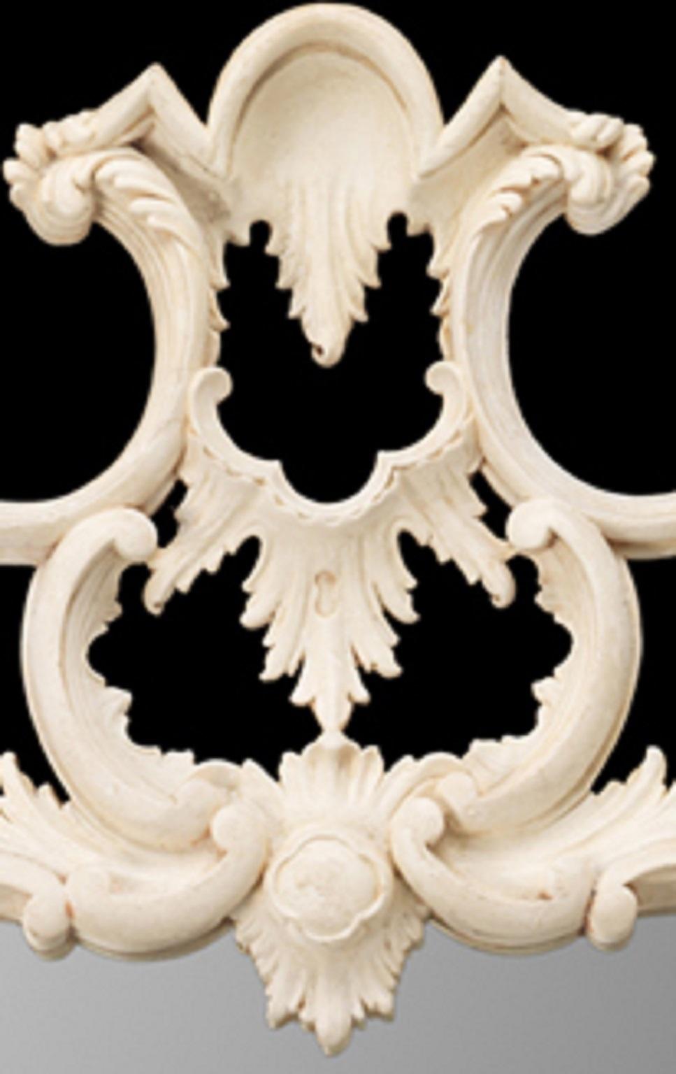 A fine Chippendale design foliate carved mirror with split glass surrounded by swags, scrolls and carved acanthus decoration. 