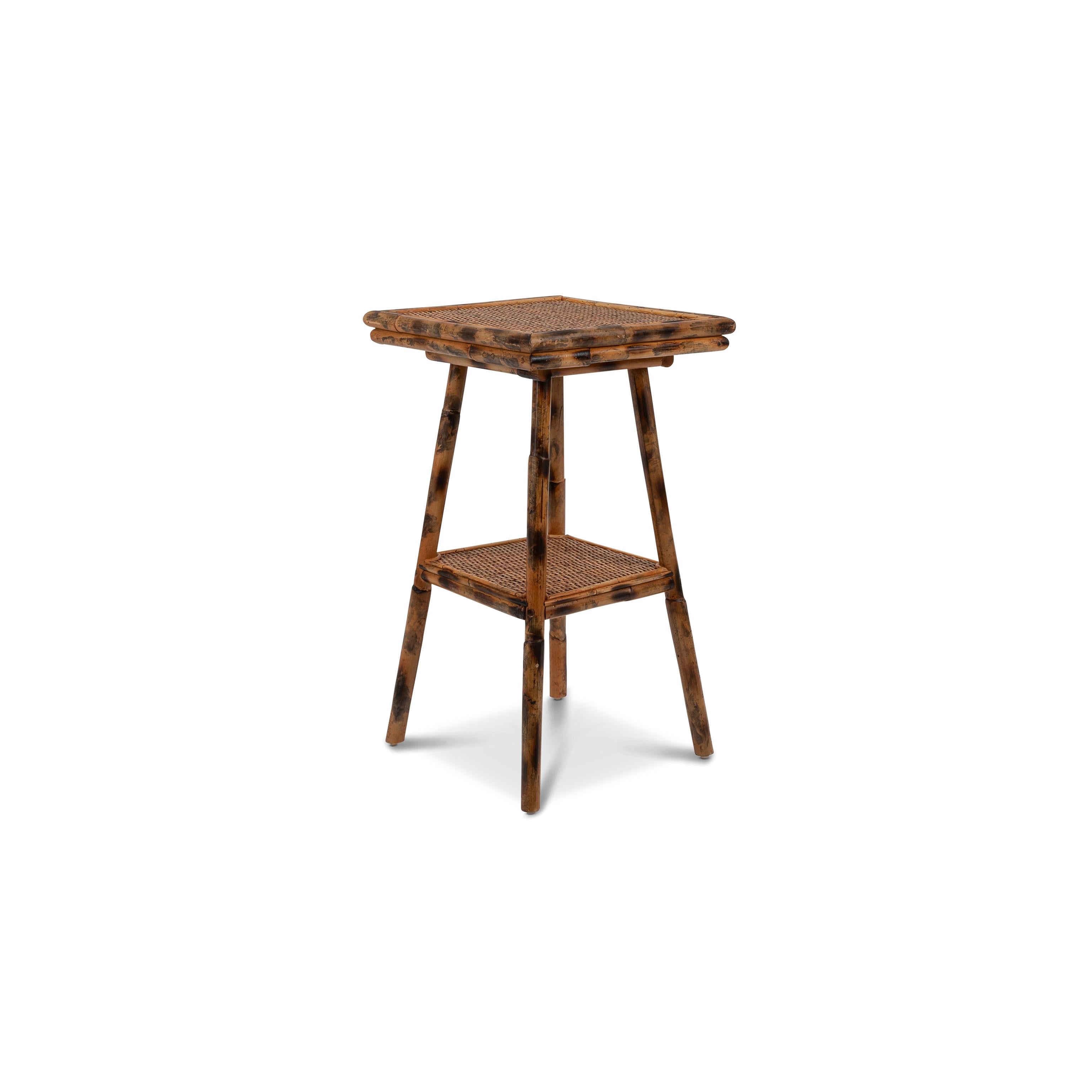 The Pimlico side table is neat and chic: its faux-bamboo legs, hand-crafted from beautiful torched rattan, call to mind the antique tables of a bygone era. Two tabletops make it practical for cups of tea by the sofa, books by the bedside or a