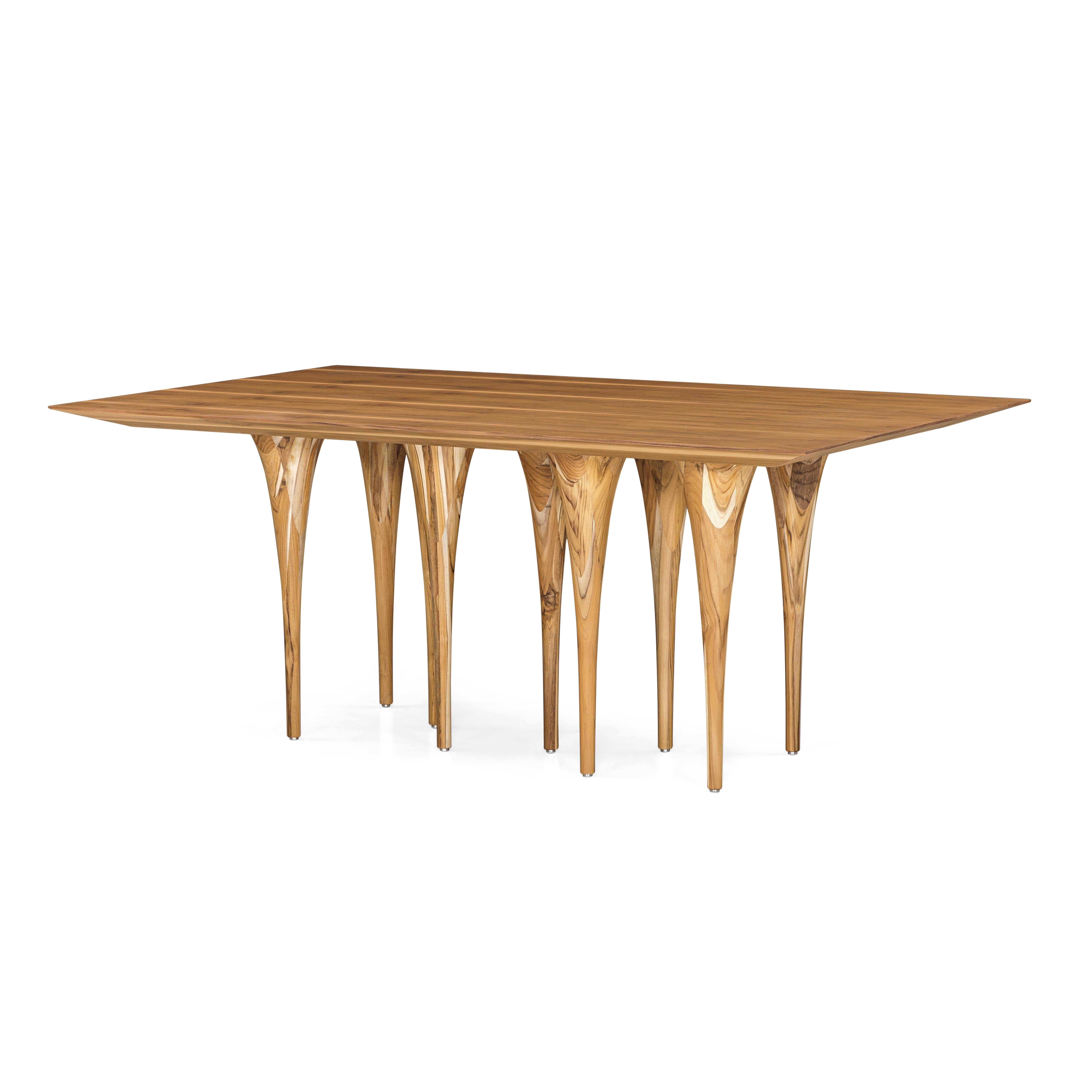 The Uultis team has created this rectangular Pin table in a teak wood finish with ten legs causing a surprising impact at first sight. It has a very singular and original structure resembling the corridors of Gothic castles, but at the same time, it