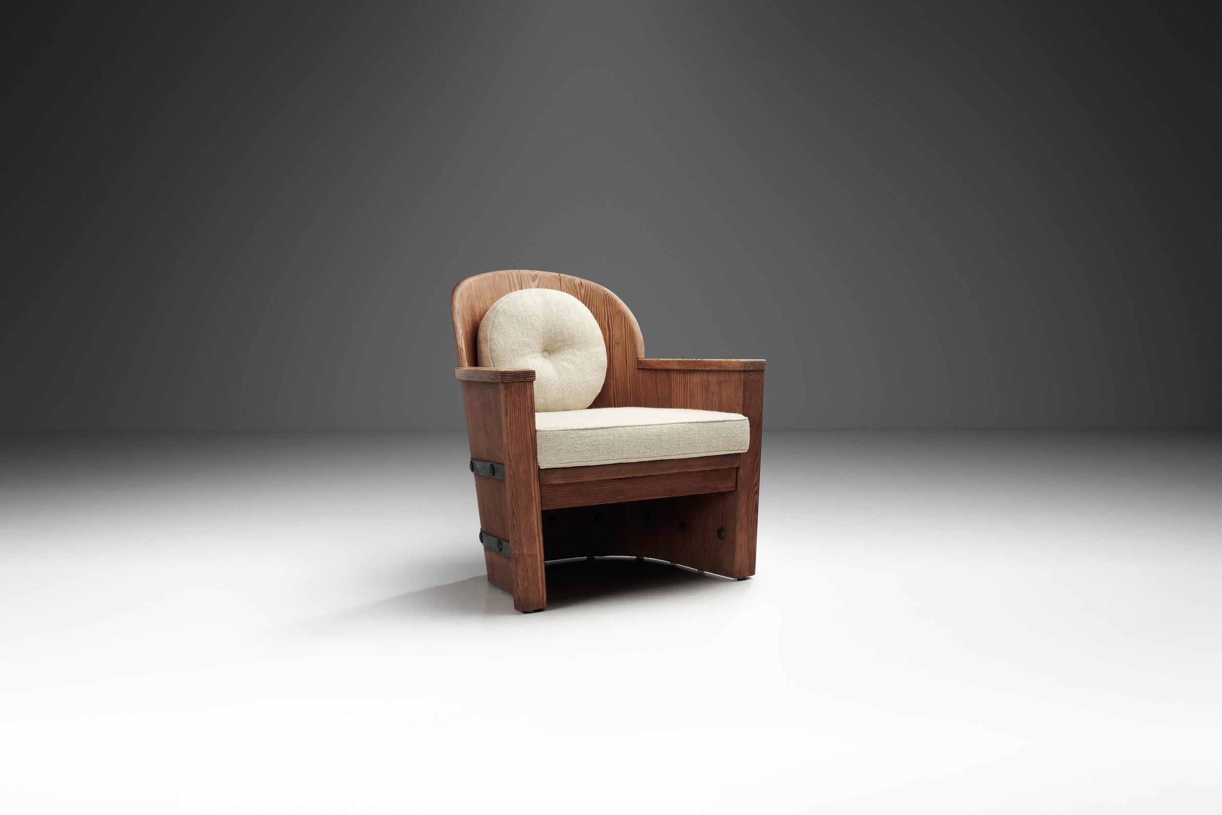 This chair is a striking example of mid-century Scandinavian design, blending natural materials with industrial elements. The chair features a robust frame constructed from solid pine, which is known for its durability and warm, organic tones. The
