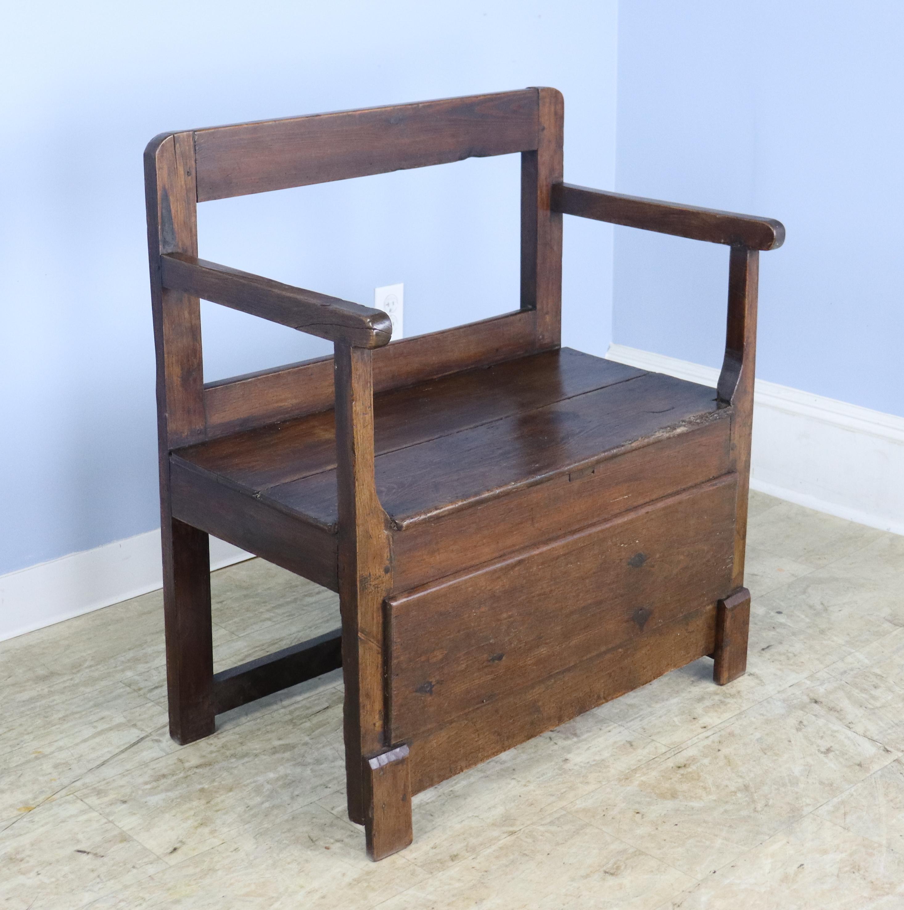A sweet 19th Century bench with a straight back and charming wooden details at the front.  Lots of good age appropriate wear and a comfortable seat height.