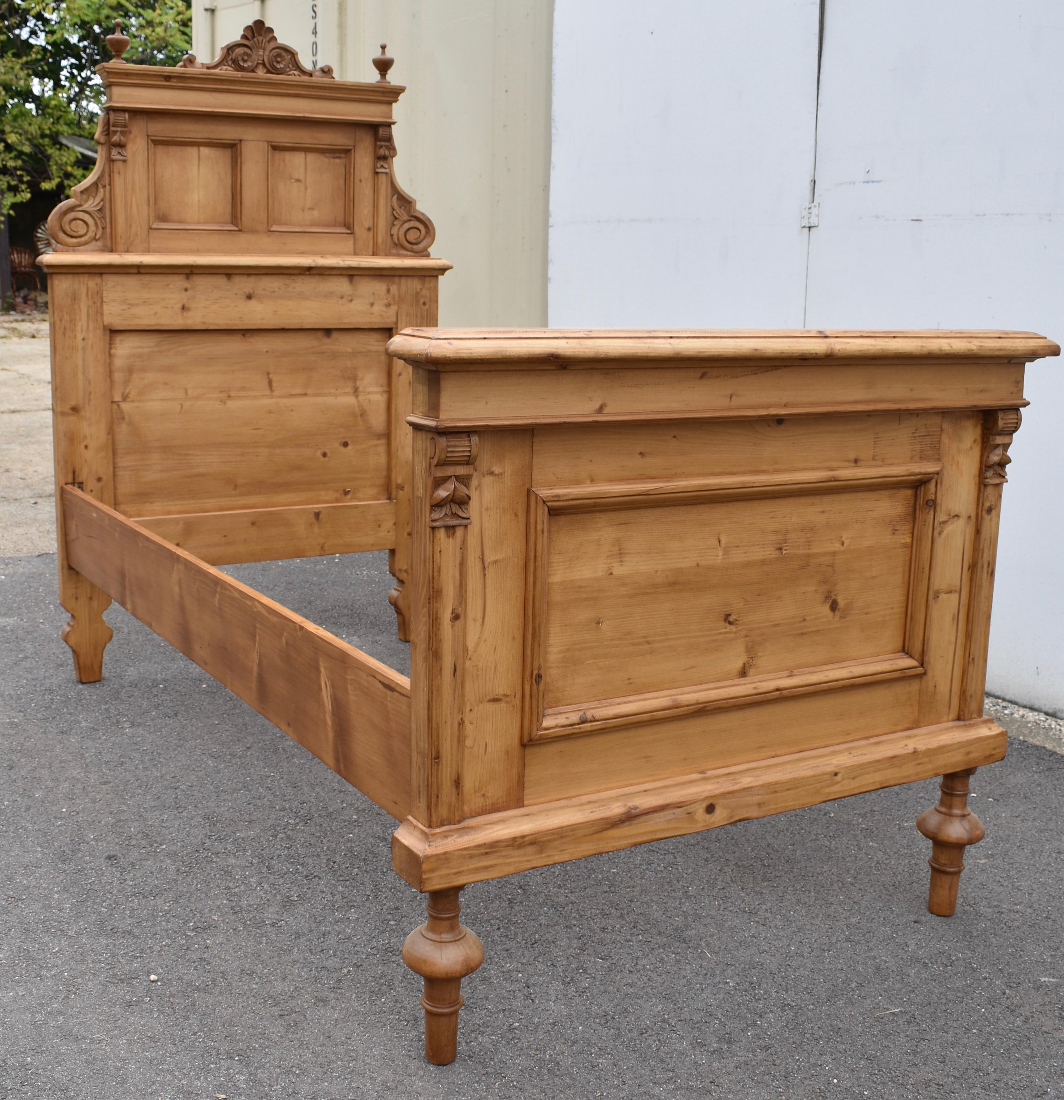 This majestic Art Nouveau box bed would be a stately presence in any child’s bedroom.  The headboard is built in two pieces.  The lower part consists of a flat panel, framed with thick rails and stiles.  The upper part has a bold crown molding