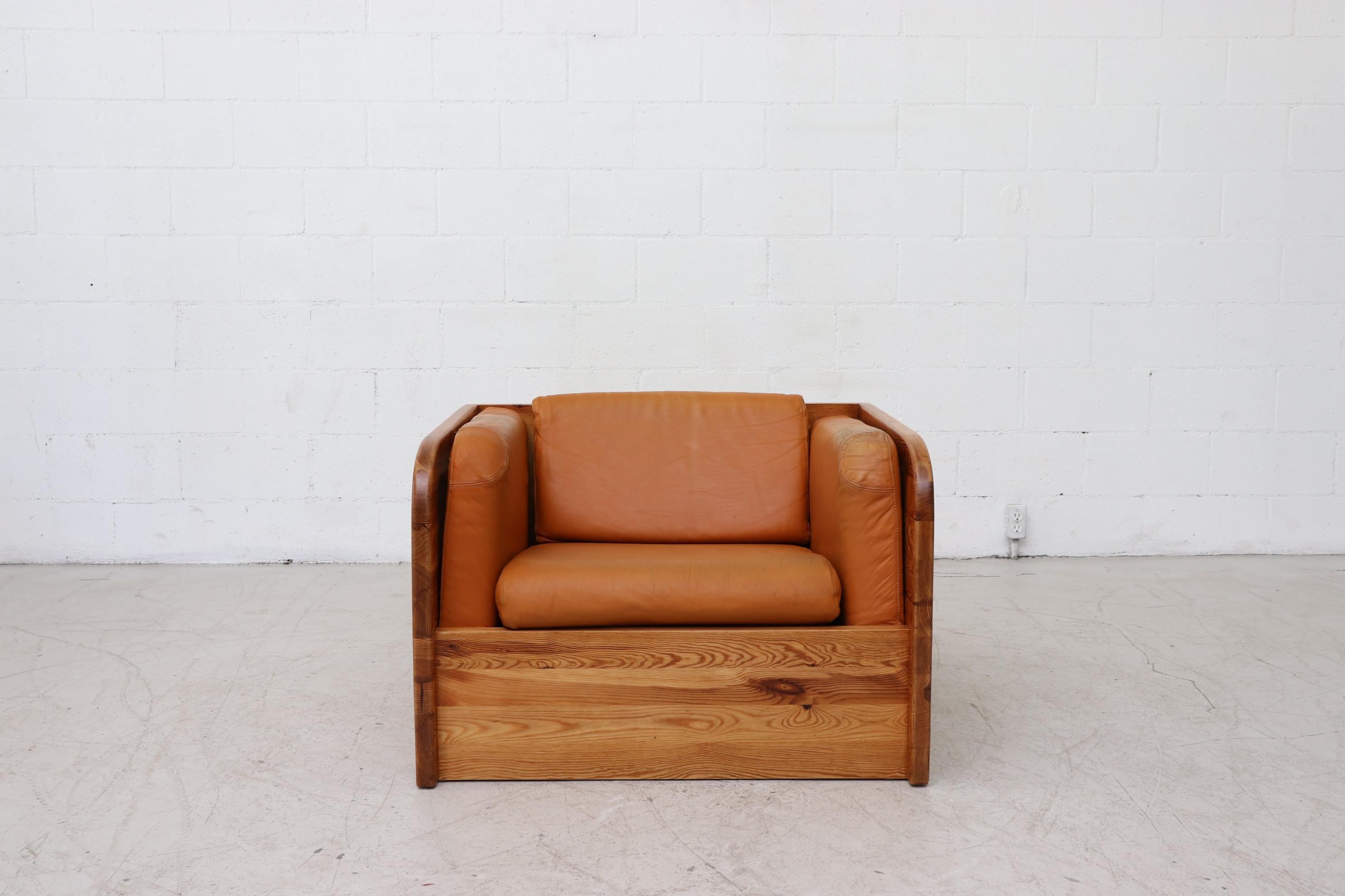 Handsome solid pine crate framed lounge chair with burnt orange leather. A midcentury design with a plesant Rustic style. Leather and frame are in original condition with some imperfections but in overall good shape. Wear is consistent with age and