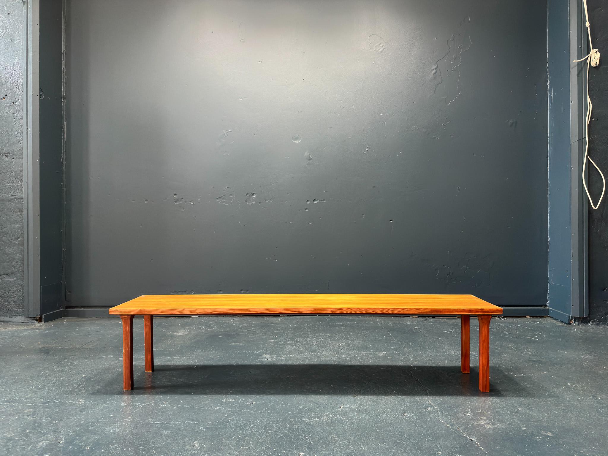 This sleek and simplistic bench is made from solid pine and features a classic knotched shaker-style leg. Having been untreated the natural wood has developed a rich warm tone in colour highlighting its natural texture and grain. The low dimensions