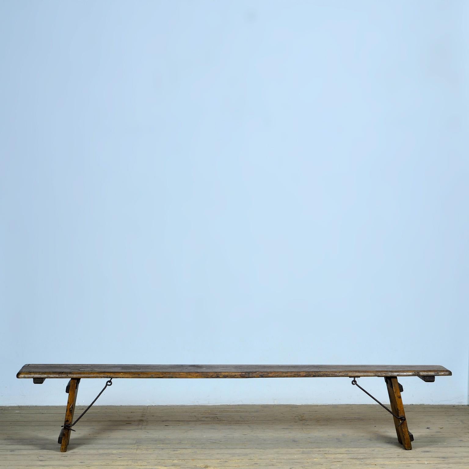 Pine bench with folding legs, circa 1900. With nice hardware on the folding legs.