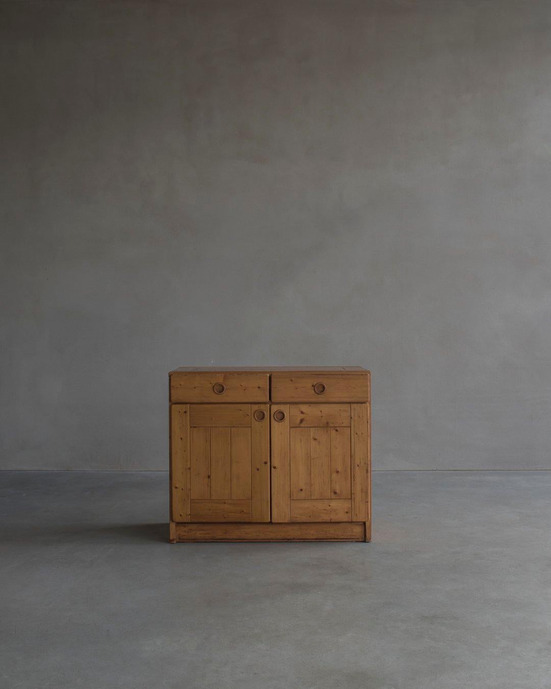 The Les Arc Sideboard by Charlotte Perriand - a stunning piece of furniture that seamlessly blends functionality and style. Originally designed in the 1960s for the Les Arcs ski resort in France, this sideboard has since become an iconic