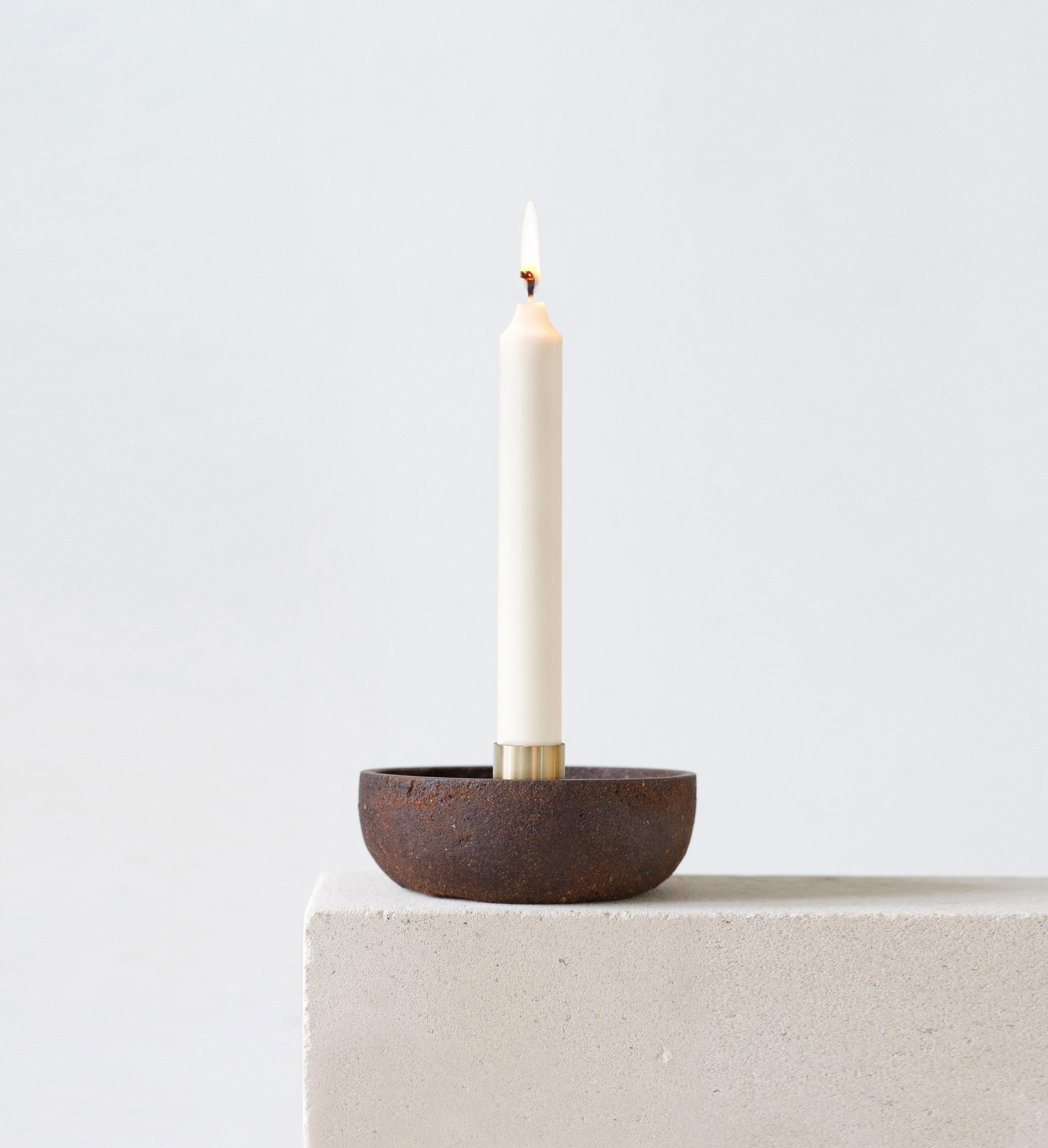 Pine candlestick holder by Evelina Kudabaite Studio
Handmade
Materials: Pine bark, brass
Dimensions: H 45 mm x D 105 mm
Colour: Reddish
Notes: For dry use

Since 2015, product designer Evelina Kudabaite keeps on developing and making GIRIA