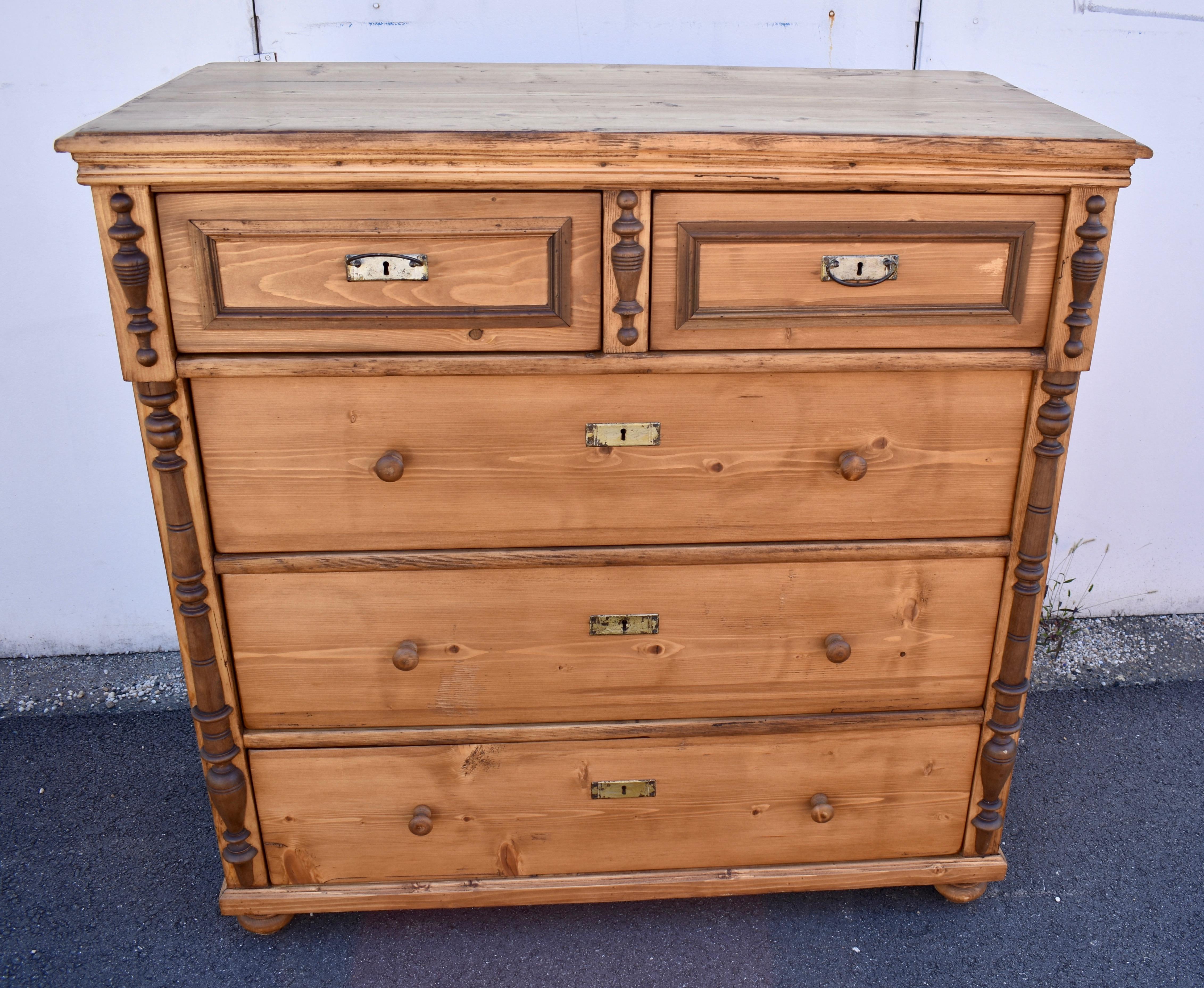 What a handsome Chest of Drawers!  What a stately presence for the master bedroom.  The step-down edge of the crown is augmented by an ogee molding beneath.  The two short top drawers stand proud of the face with hardwood trim creating faux panels. 