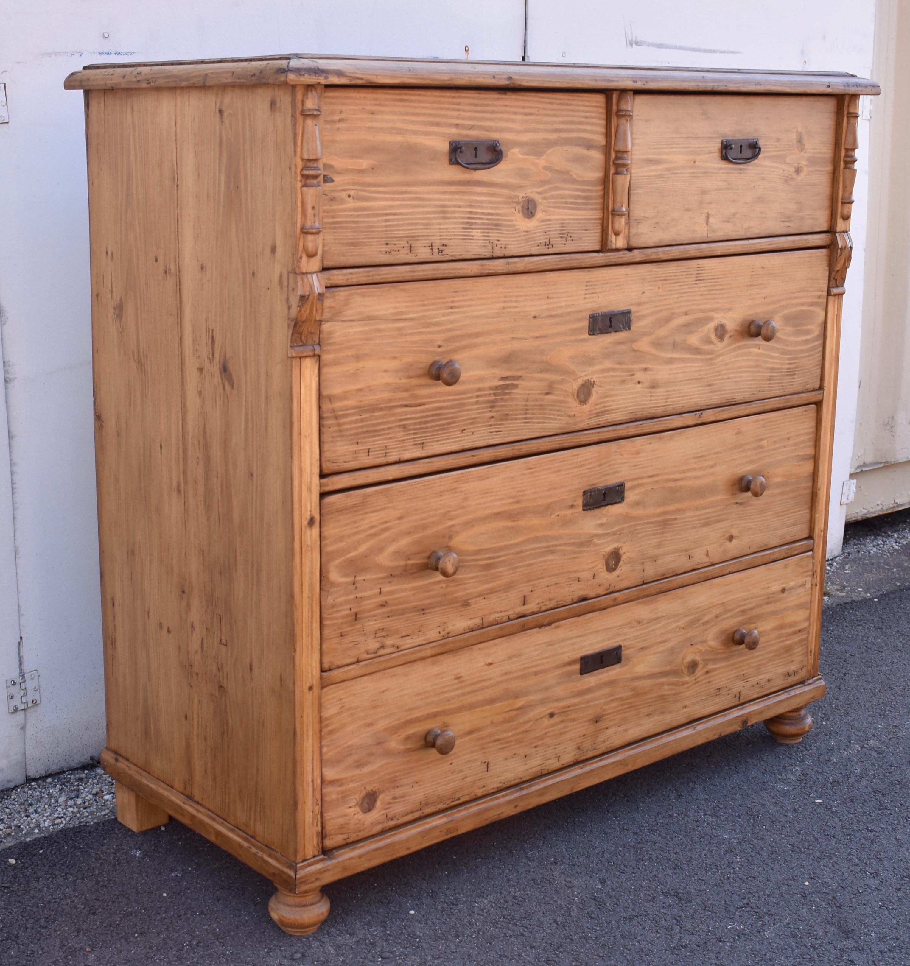 This large chest of five drawers has a lovely warm color and a strong grain pattern to the drawer fronts.  Applied crown molding around the top gives it a step-down effect and exposes the dovetails that join the top to the sides.  The deep top