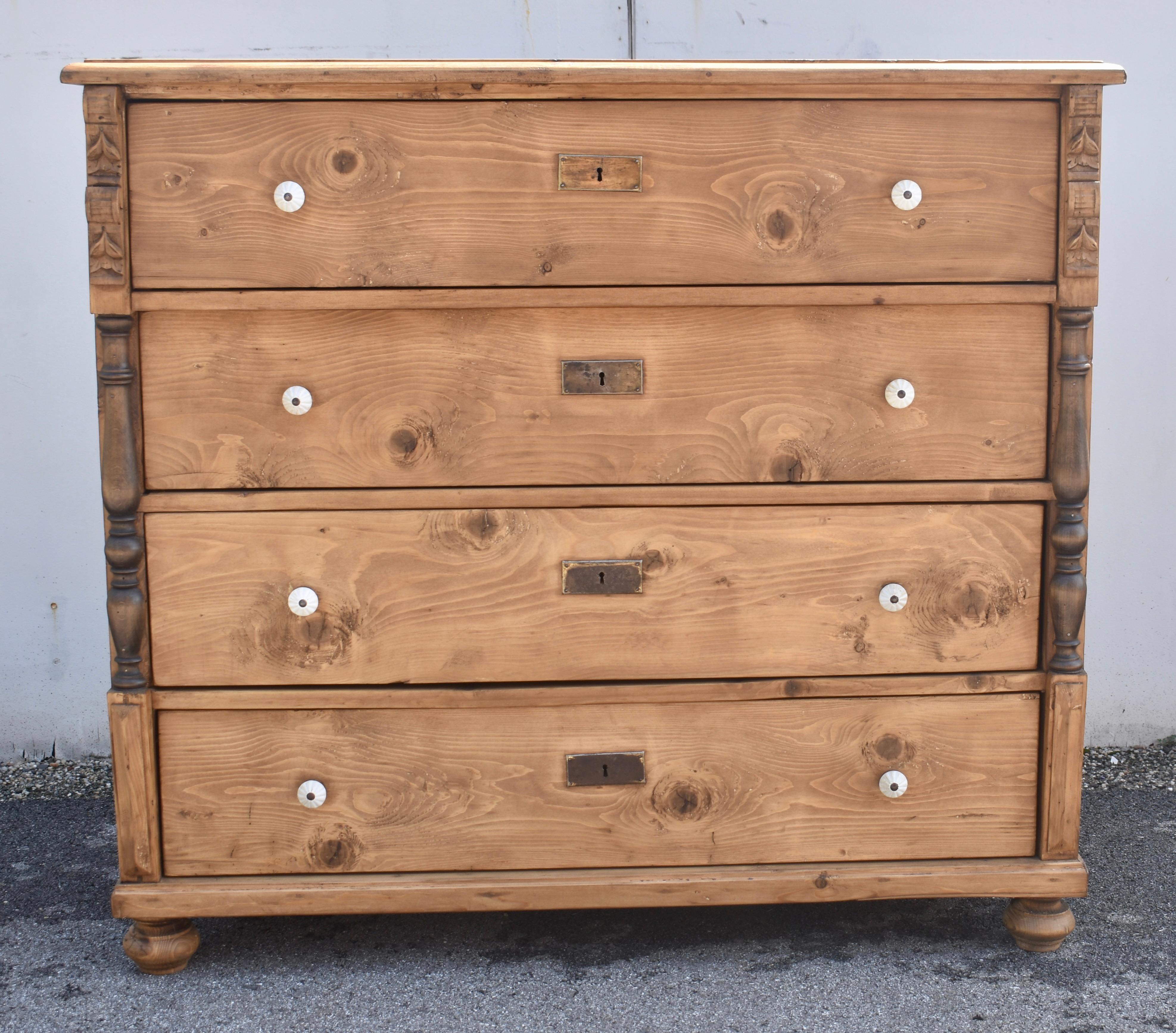 This handsome chest of four equal hand-cut dovetailed drawers has great color and is characterized by an attractive grain pattern of massive swirls sweeping across the drawer fronts and sides.  The top has a routed step-down edge and the front