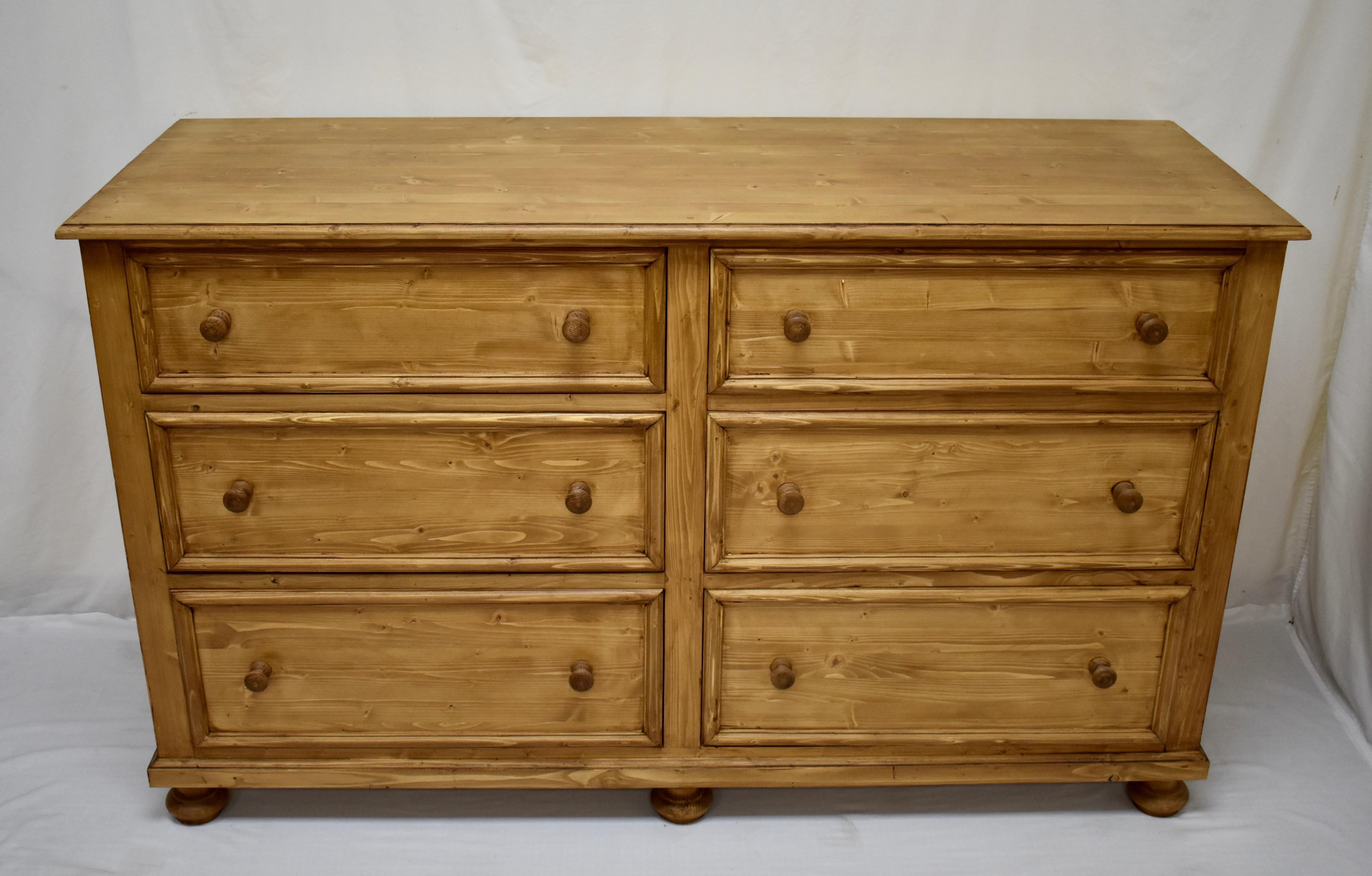 Long chests of drawers can be hard to find in antique pine so our workshop in Europe takes lightly-used reclaimed pine to build this piece using design features and methods of construction seen on our antique pieces. This long chest of six slightly