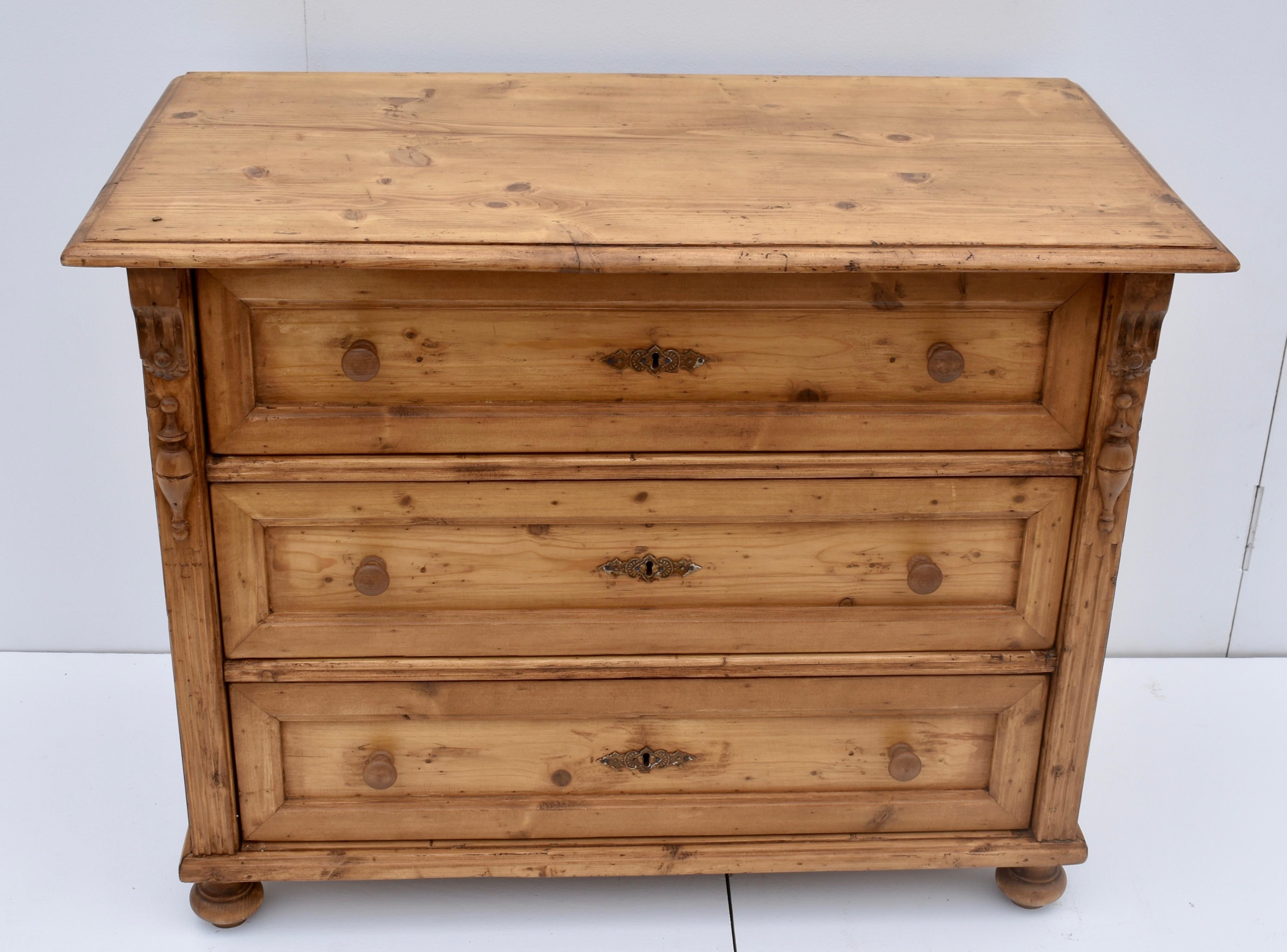 This attractive little German three drawer chest has a step-down routed edge to the top. The three deep hand-cut dovetailed drawers are trimmed with wide molding at the front, giving them the appearance of flat panels. The front corners are