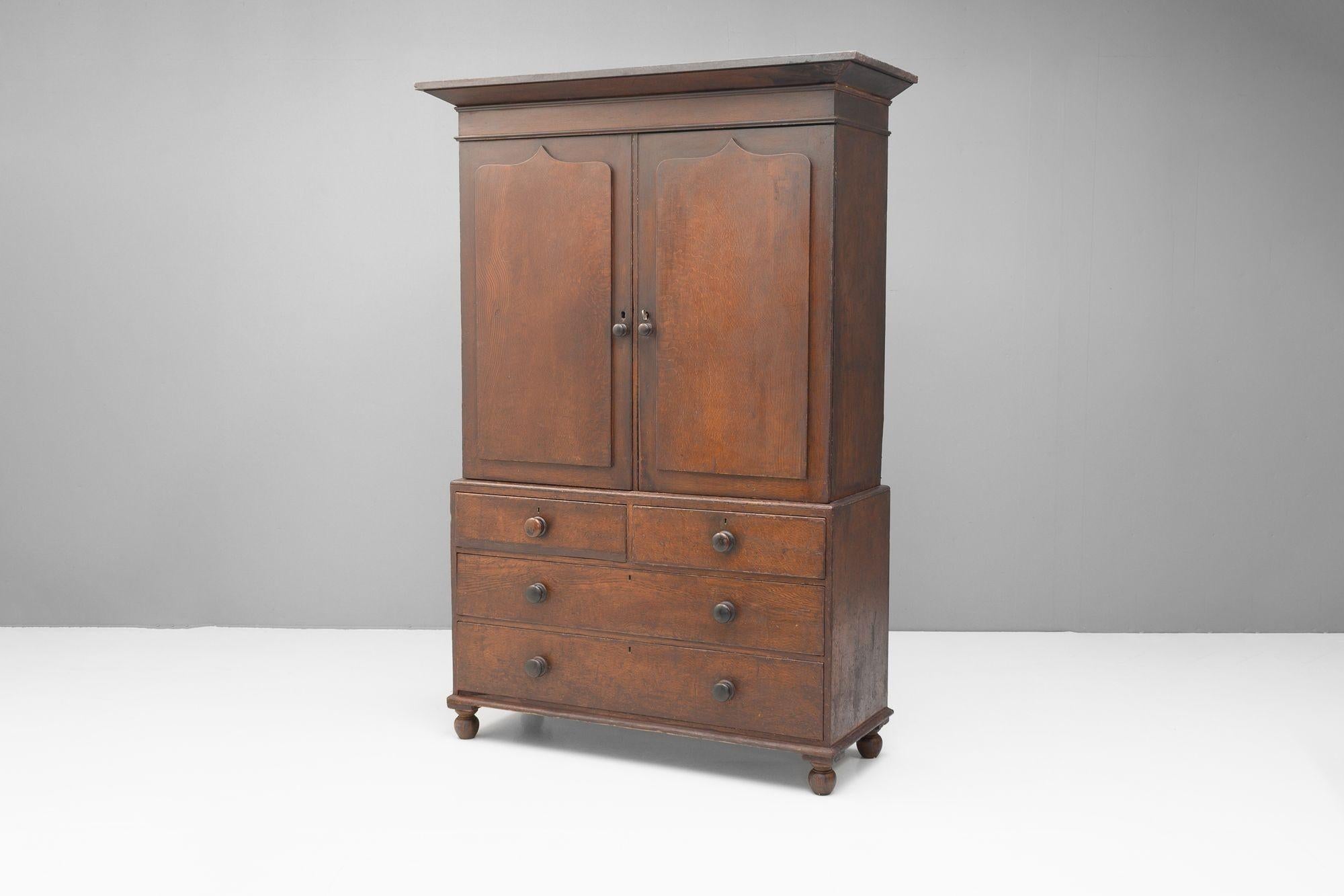 Pine cupboard on chest base in original painted finish. Circa 1870.