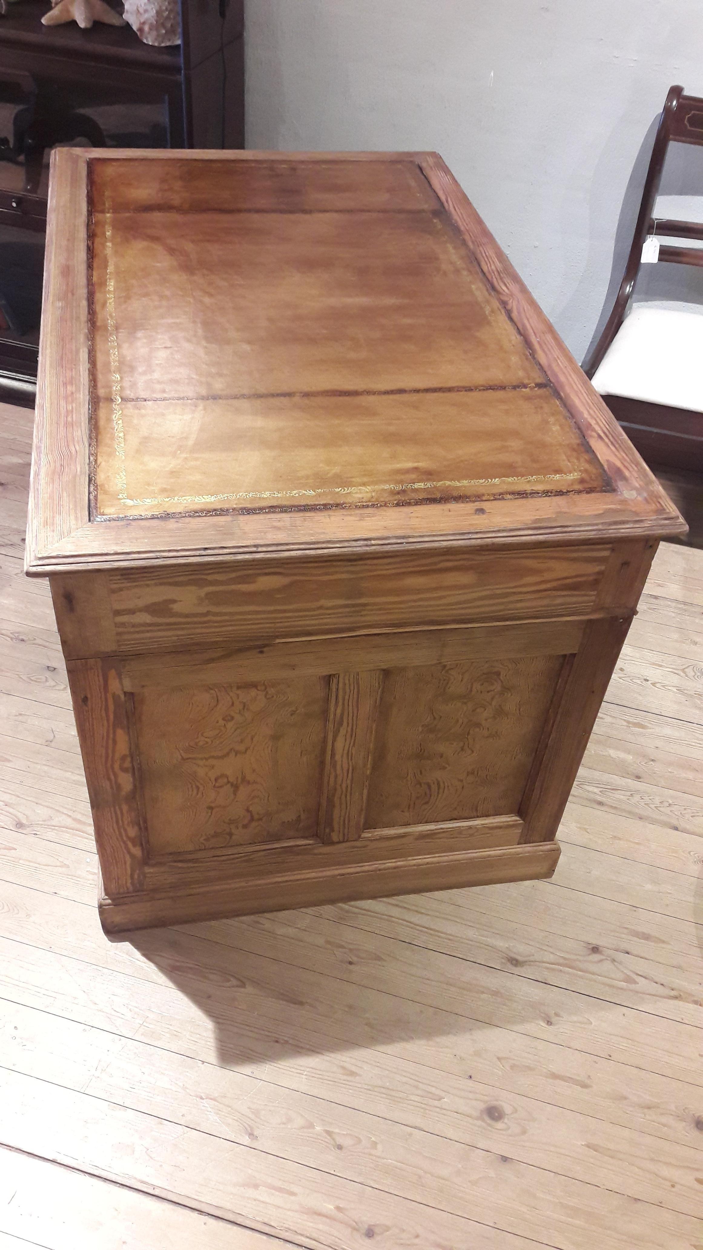 Small stripped pine desk with tan leather and great brass handles.
The leather can be changed to another color (with a surcharge).
 