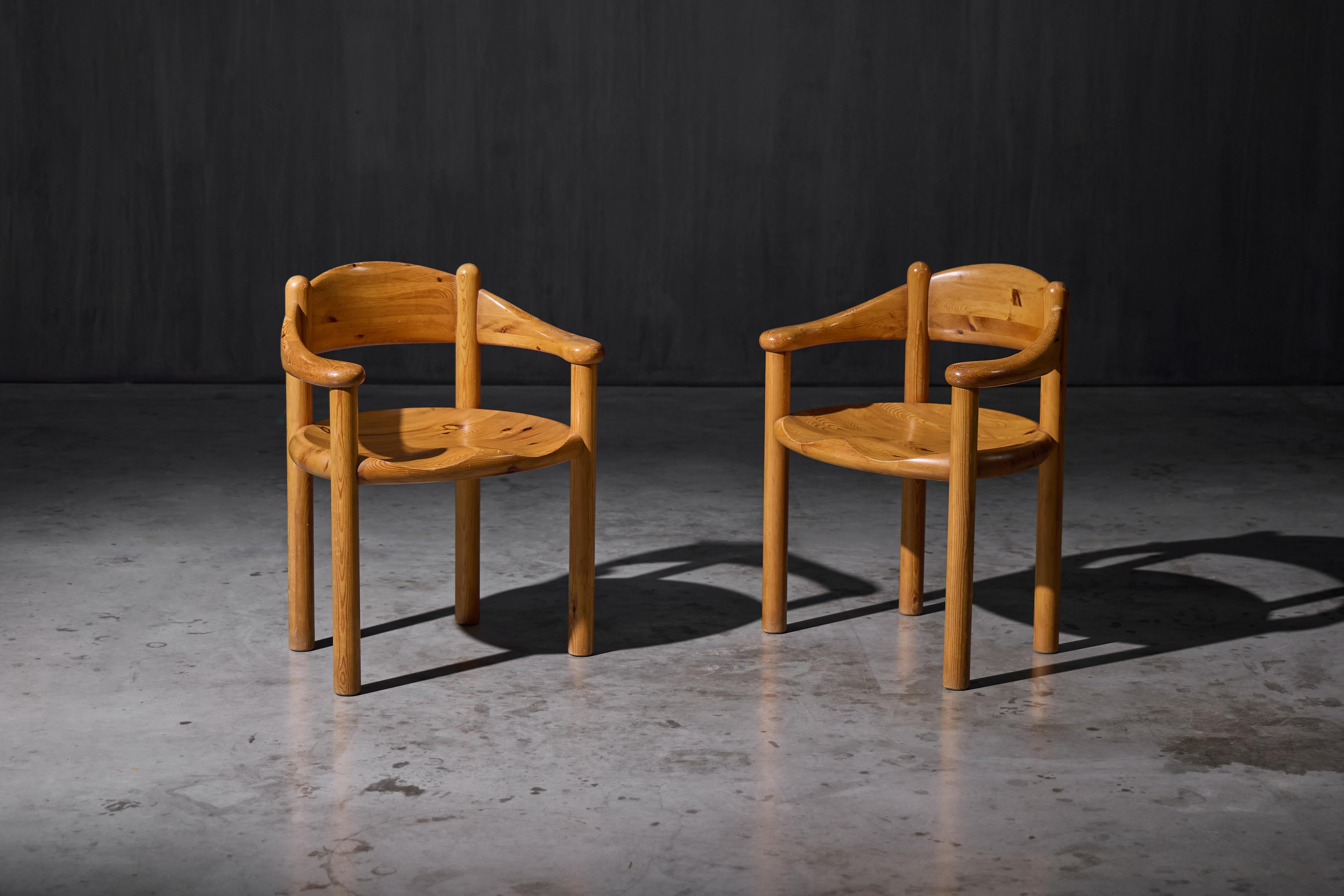 Armchairs designed by Rainer Daumiller for Hirtshals Savværk in 1970s Denmark. Crafted from solid pine with beautifully rounded curves, they offer exceptional comfort and durability. Over the years, the wood has developed a rich patina, enhancing