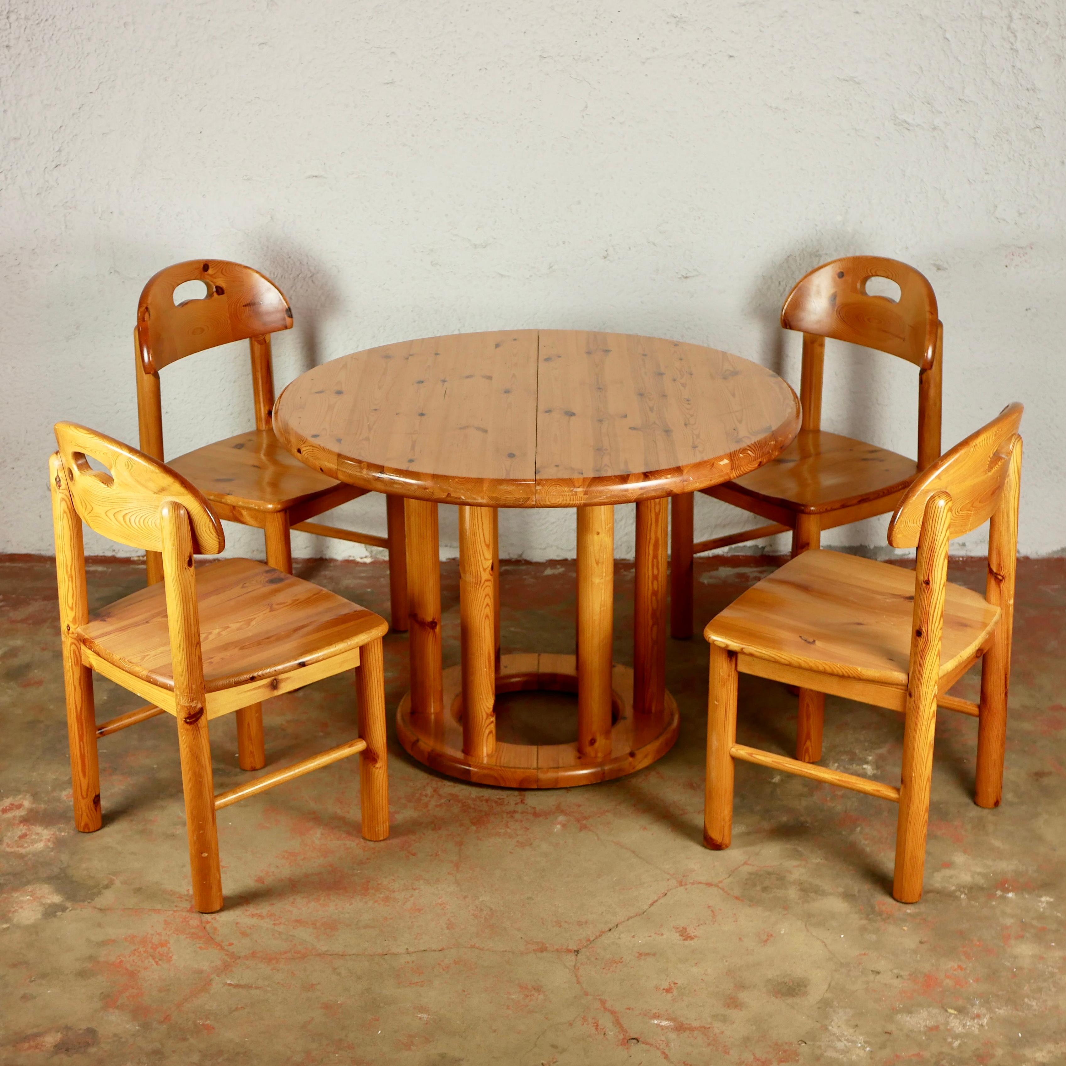 Wonderful dining room set designed by Rainer Daumiller for Hirtshals Savværk, Denmark, in the 1970s, made of 1 extendable table with 2 extensions, and 4 sturdy chairs, all in massive pine wood. 
Curvy lines, perfect for adorable interiors. 
The 2