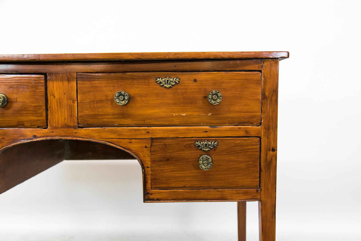 Pine English four-drawer console table is supported by four tapered legs and an arched apron with beaded molding. It has been refinished in a darker color.