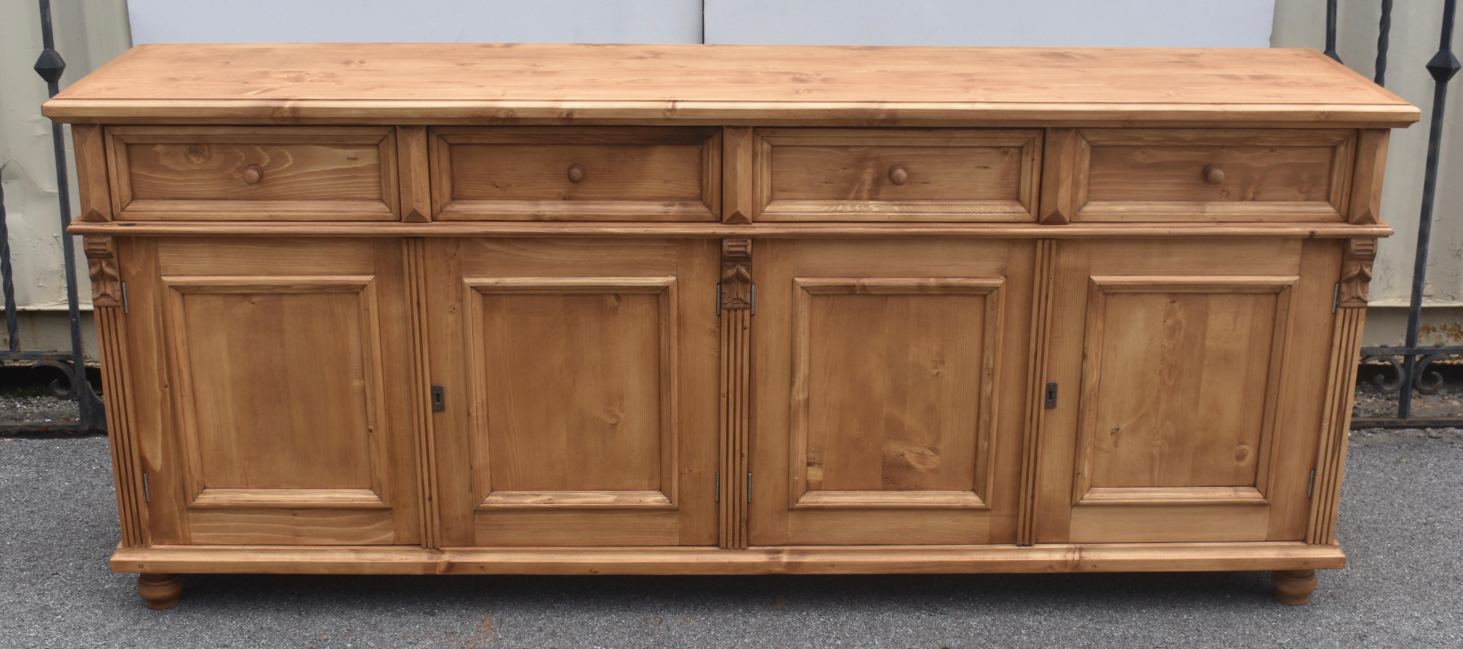 Antique pine sideboards can be hard to find so our workshop in Europe takes good quality European yellow pine to build this piece using traditional design features and construction techniques.  In this case the sideboard base is hand-polished with