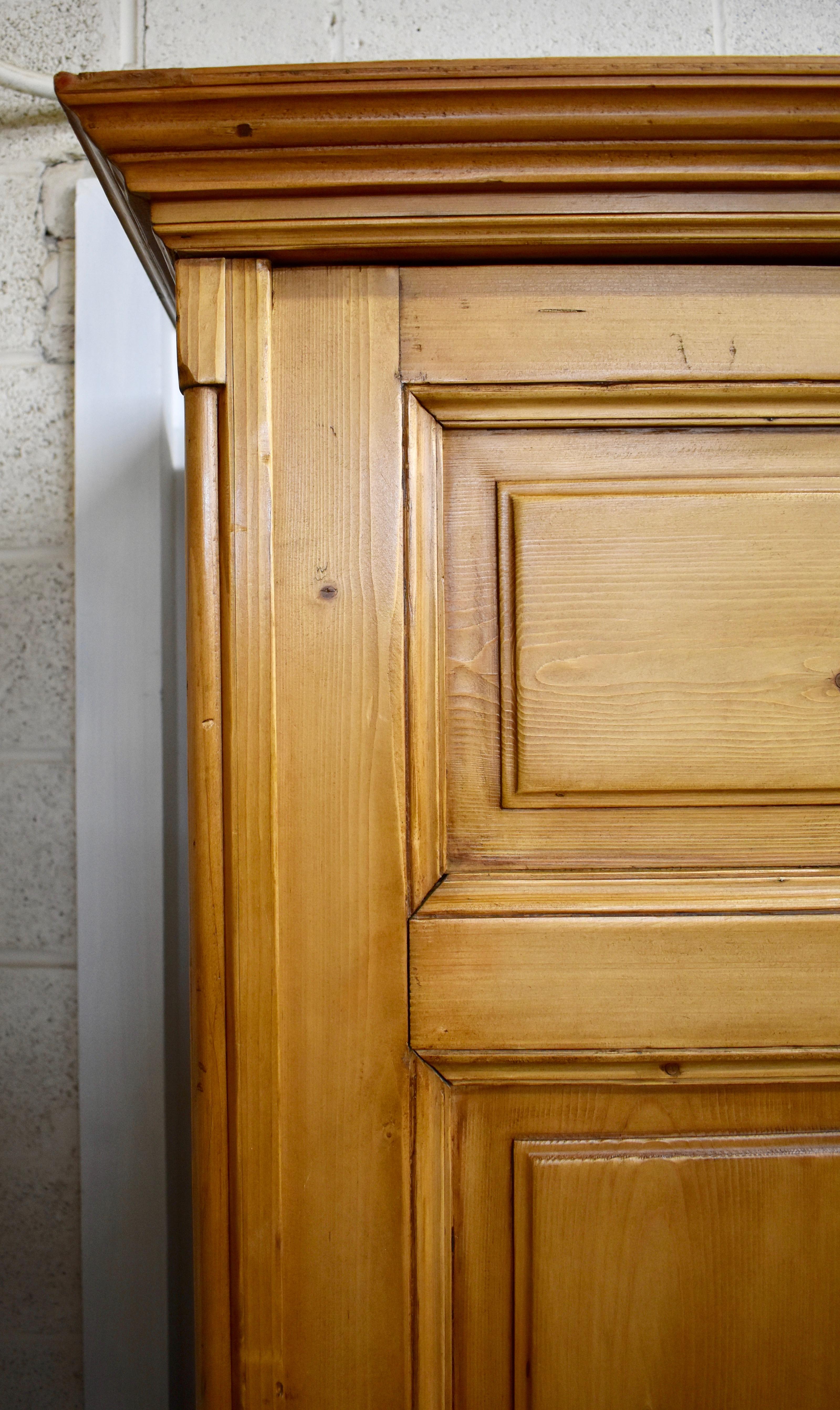 Polished Pine Four-Door Knock-Down Armoire
