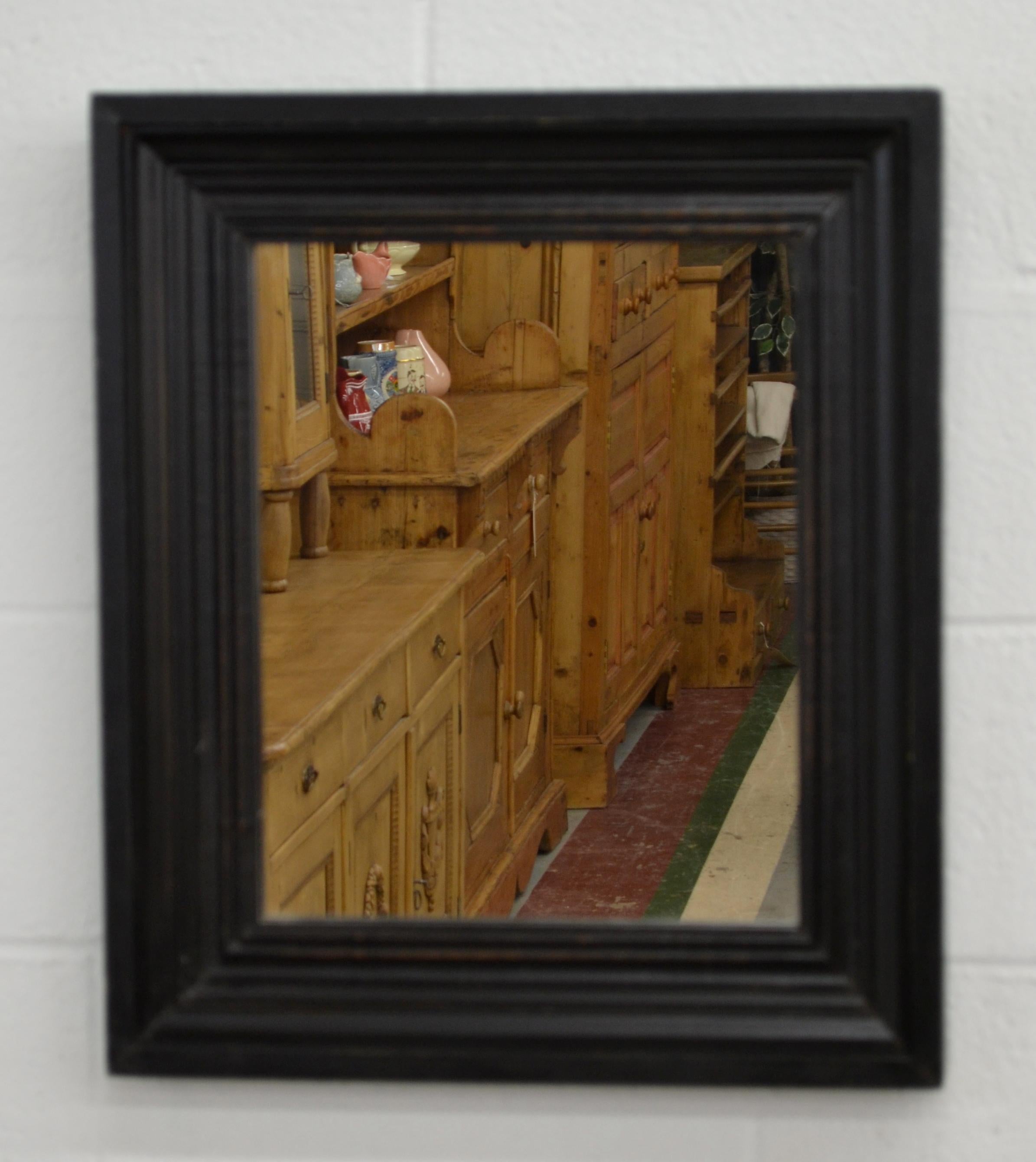 This handsome wall mirror has a bold and beautifully contoured frame molding, 3.5