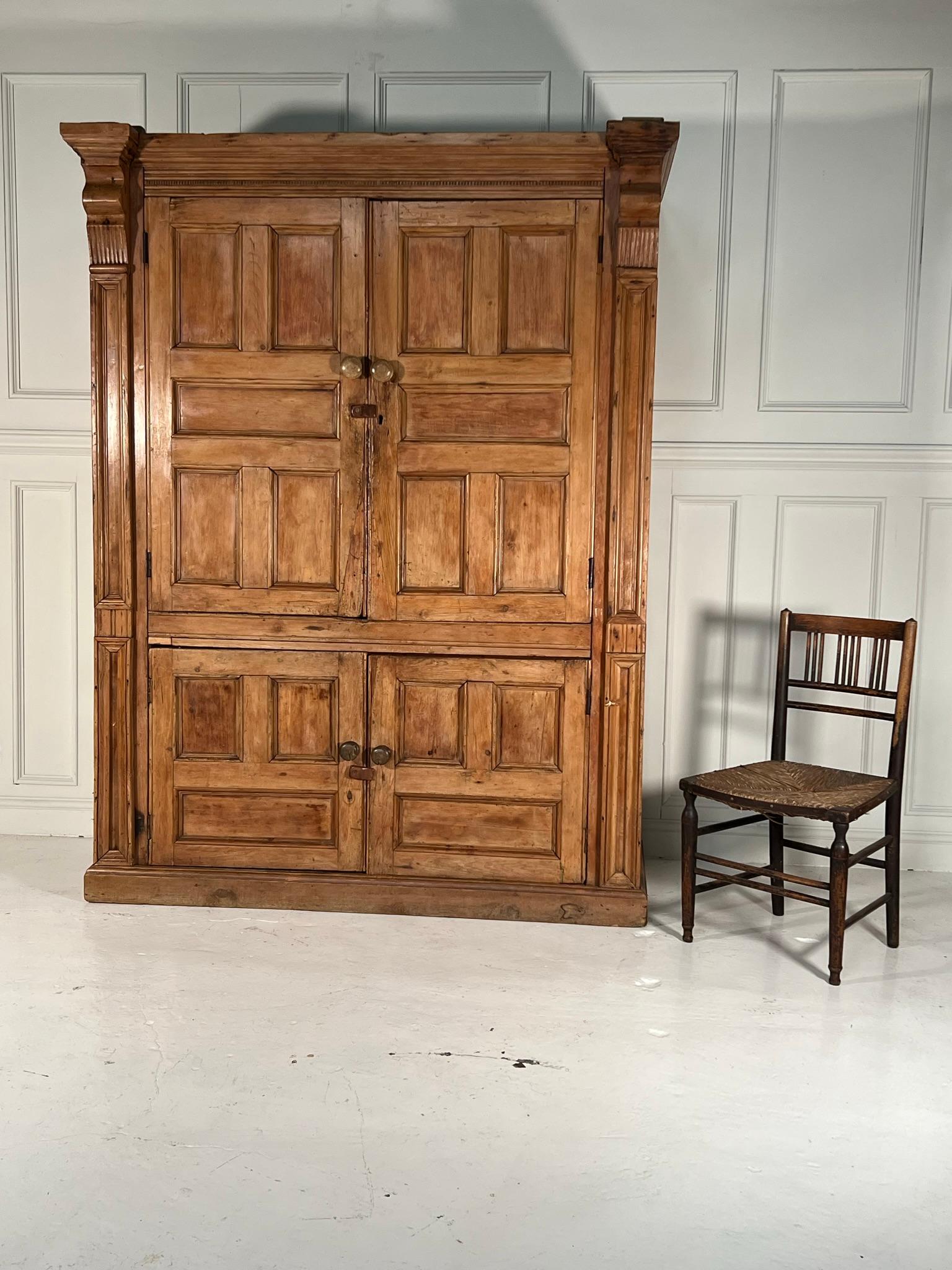 ‘Vernacular perfection for your kitchen or boot room’

A rare example of a mid 19th century, pine, Irish food press/cupboard.

Wonderful patination to the timber showing knocks and bumps and old repairs.

The hinged doors close using original clasps