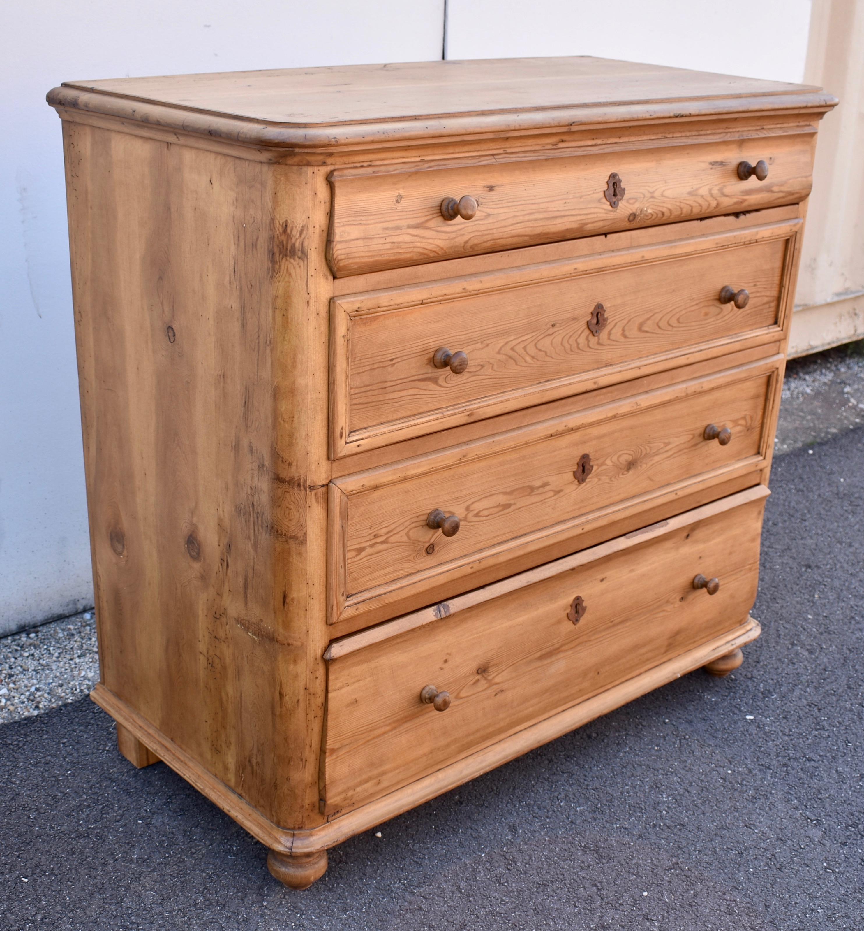 What a good looking chest of drawers!  The top has a step-down routed edge which forms a handsome crown placed above a concave molding.  The front corners are nicely rounded, giving the whole piece a softer appearance.  The shallow top and deep